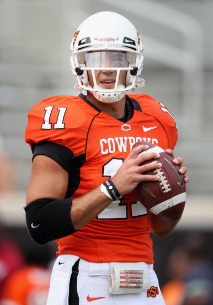 STILLWATER, OK - SEPTEMBER 05:  Quarterback Zac Robinson #11 of the Oklahoma State Cowboys warms up before the college football game against the Georgia Bulldogs at Boone Pickens Stadium on September 5, 2009 in Stillwater, Oklahoma.  The Cowboys defeated 