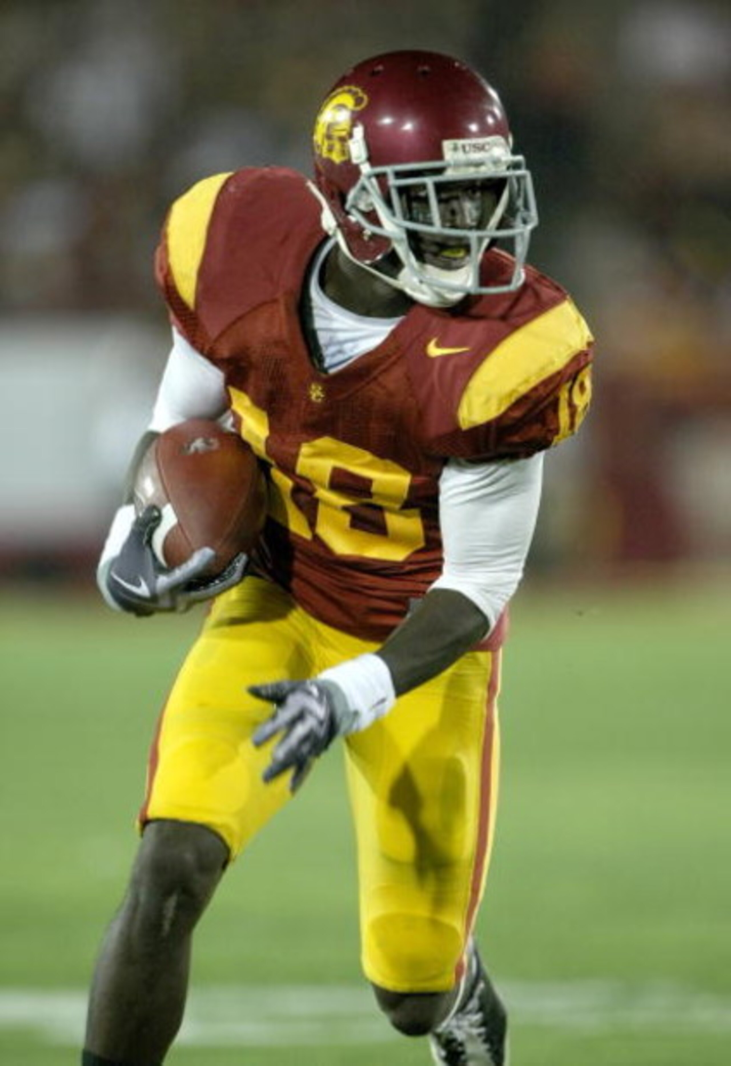 LOS ANGELES, CA - SEPTEMBER 26: Wide receiver Damian Williams #18 of the USC Trojans carries the ball against the Washington State Cougars on September 23, 2009 at the Los Angeles Coliseum in Los Angeles, California. USC won 27-6. (Photo by Stephen Dun LOS ANGELES, CA - SEPTEMBER 26: Wide receiver Damian Williams #18 of the USC Trojans carries the ball against the Washington State Cougars on September 23, 2009 at the Los Angeles Coliseum in Los Angeles, California. USC won 27-6. (Photo by Stephen Dun