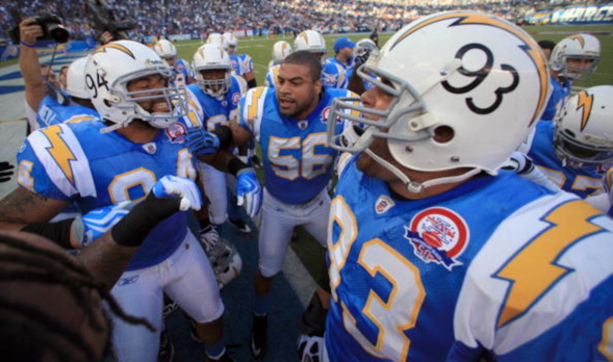 SAN DIEGO, CA - OCTOBER 19:  Linebacker Shawn Merriman #56, Jyles Tucker #94, and Luis Castillo #93 of the San Diego Chargers leads the team in a cheer before the start of the game against the Denver Broncos during Monday Night Football on October 19, 200