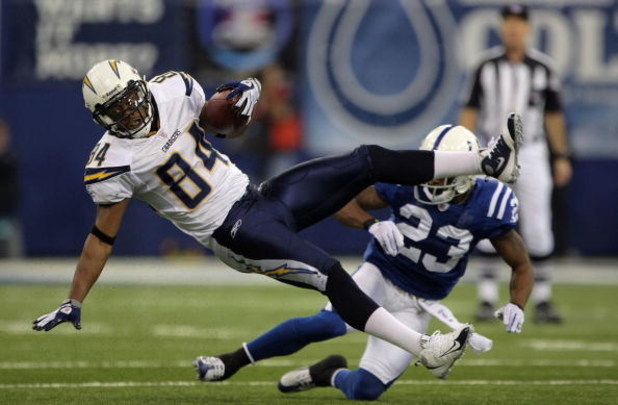 INDIANAPOLIS - JANUARY 13:  Buster Davis #84 of the San Diego Chargers makes a reception for a first down against Tim Jennings #23 of the Indianapolis Colts against the San Diego Chargers during their AFC Divisional Playoff game at the RCA Dome on January