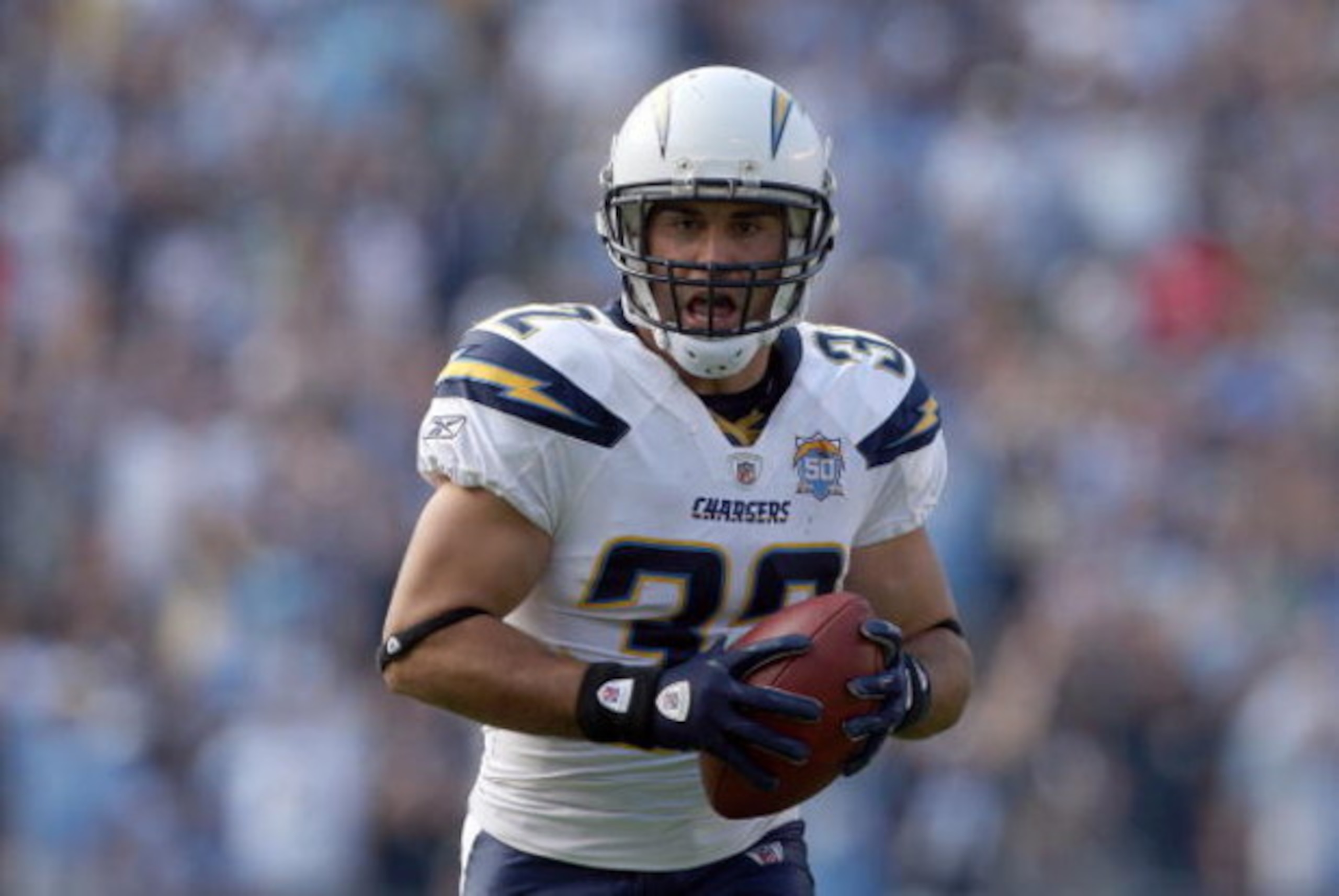 SAN DIEGO, CA - SEPTEMBER 27:  Free-Safety Eric Weddle #32 of the San Diego Chargers intercepts the ball and runs in back for a touchdown late in the fourth quarter against the Miami Dolphins at Qualcomm Stadium on September 27, 2009 in San Diego, Califor