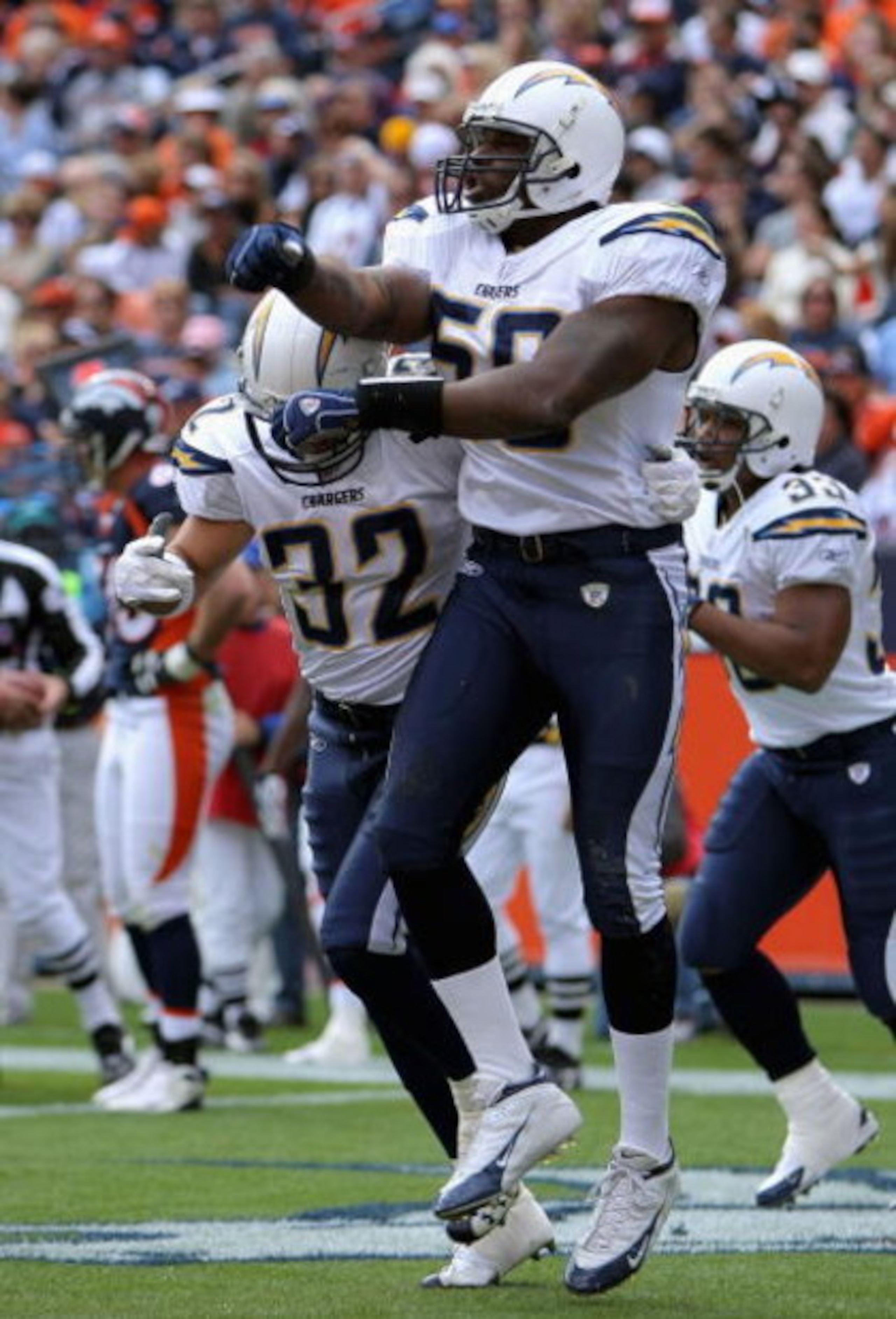 DENVER - OCTOBER 7:  Linebacker Brandon Siler #59 of the San Diego Chargers celebrates his 23 yard fumble recovery touchdown against the Denver Broncos during the first quarter of the game at Invesco Field at Mile High October 7, 2007 in Denver, Colorado.