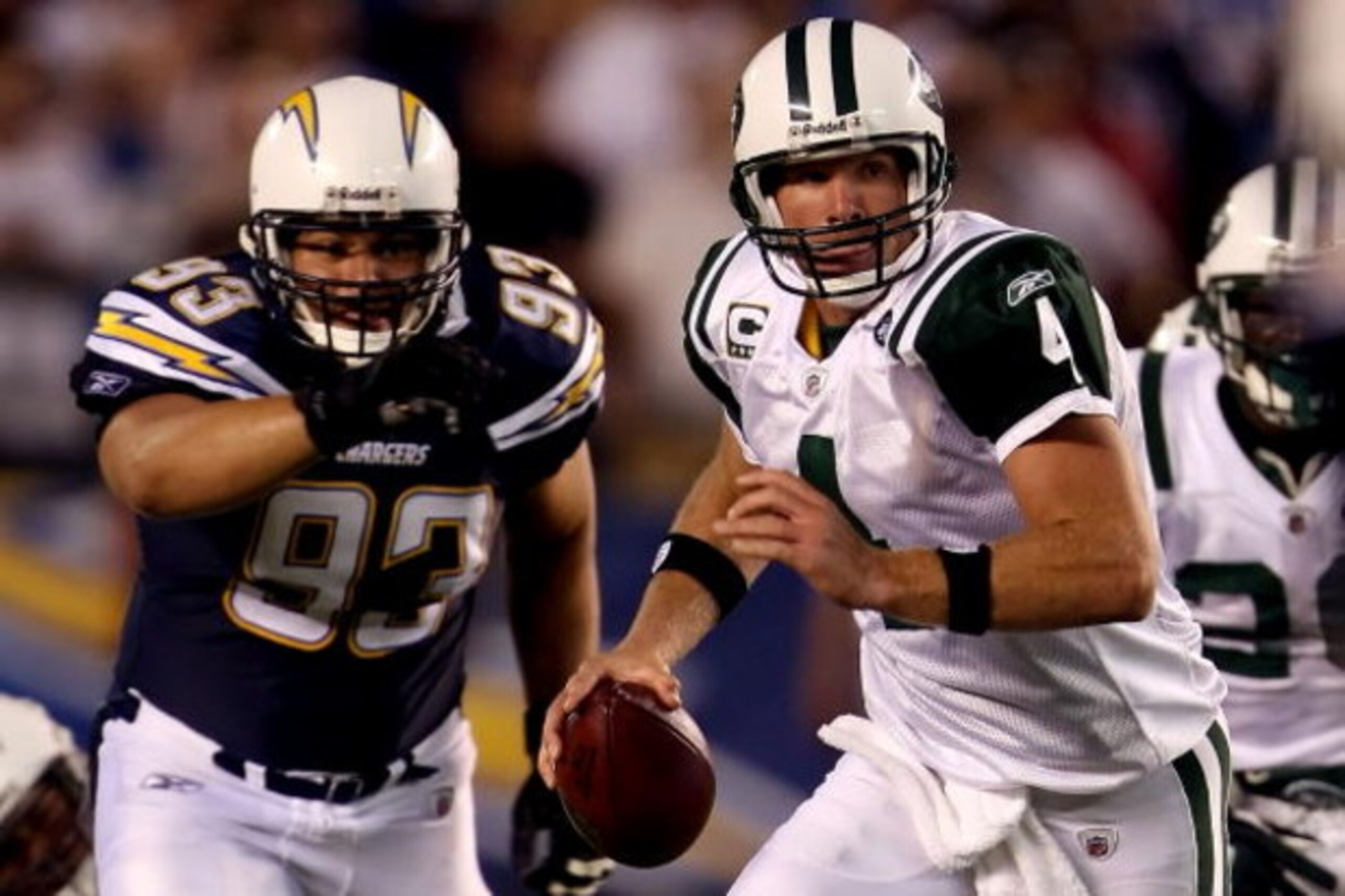 SAN DIEGO - SEPTEMBER 22:  Brett Favre #4 of the New York Jets looks to pass the ball as he is chased by Luis Castillo #93 of the San Diego Chargers on September 22, 2008 at Qualcomm Stadium in San Diego, California.  (Photo by Stephen Dunn/Getty Images)