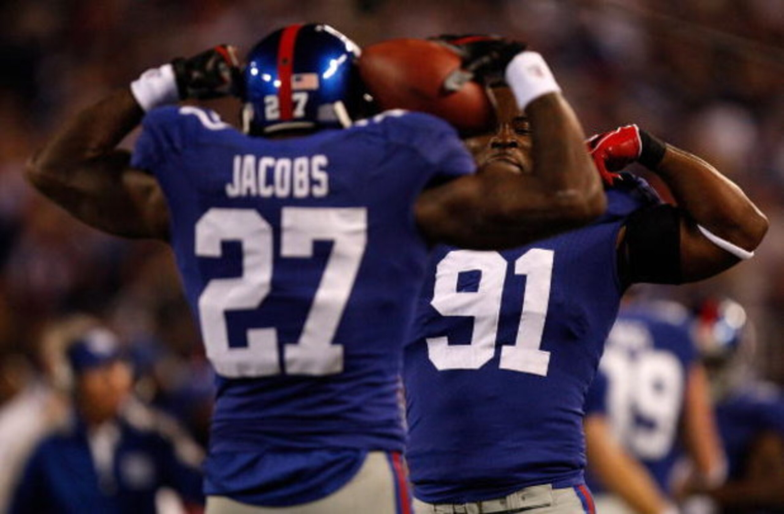 EAST RUTHERFORD, NJ - OCTOBER 25: Brandon Jacobs #27 celebrates with teammate Justin Tuck #91 of the New York Giants after Jacobs ran for a touchdown against the Arizona Cardinals on October 25, 2009 at Giants Stadium in East Rutherford, New Jersey. (Phot