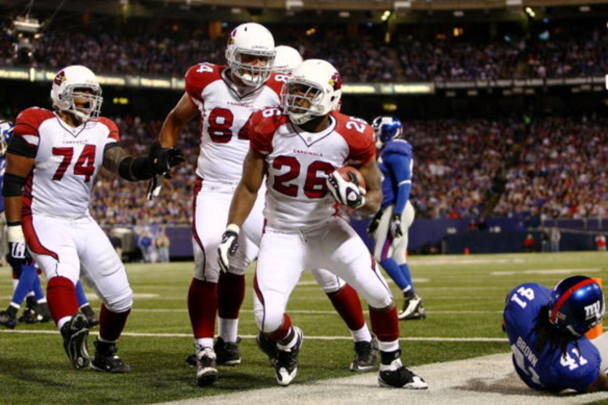 EAST RUTHERFORD, NJ - OCTOBER 25:  Beanie Wells #26 of the Arizona Cardinals is congratulated by team mates after scoring a touchdown against the New York Giants to score a touchdown on October 25, 2009 at Giants Stadium in East Rutherford, New Jersey.  (