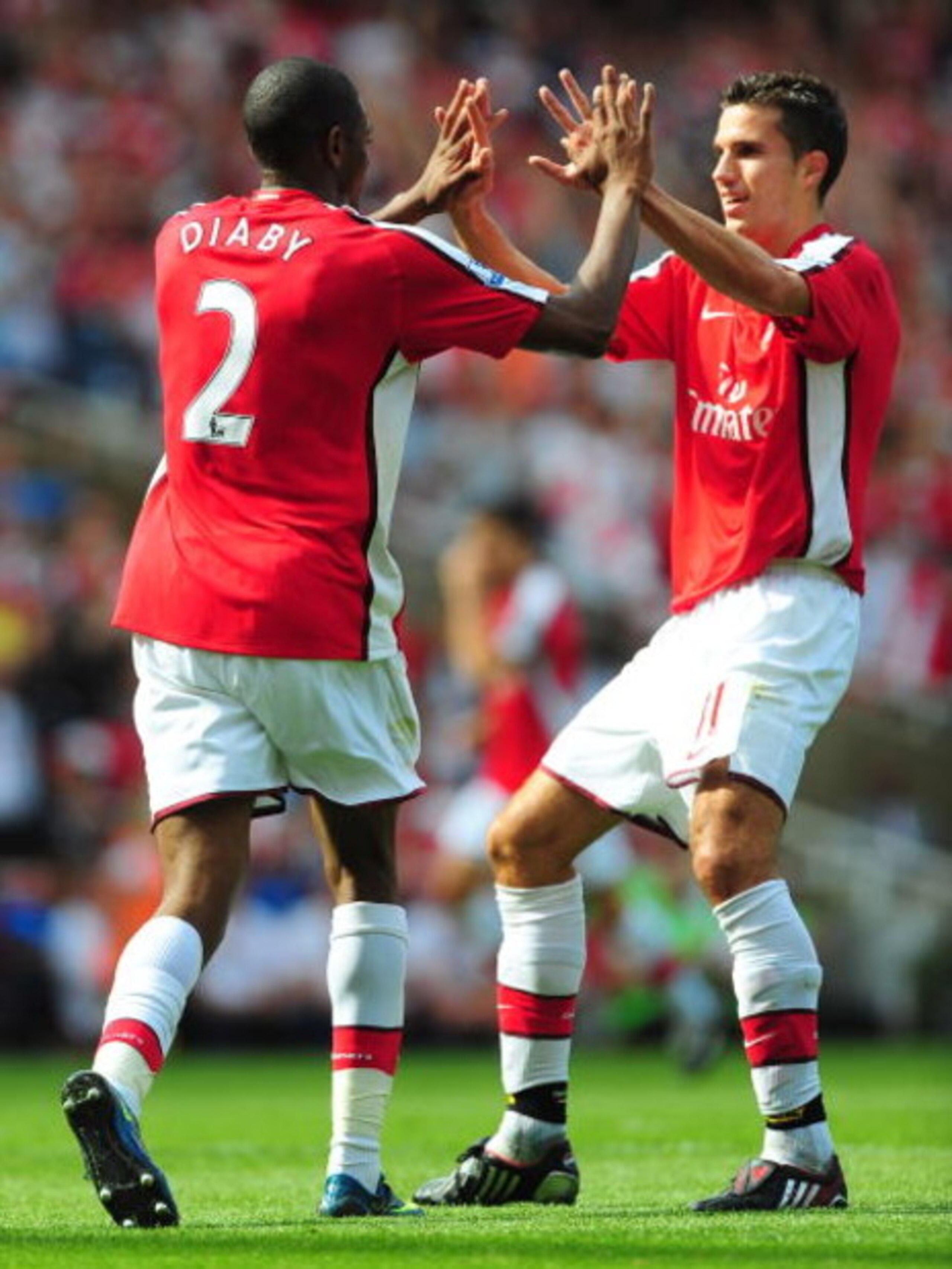 LONDON, ENGLAND - AUGUST 22:  Abou Diaby of Arsenal celebrates his goal with teammate Robin van Persie during the Barclays Premier League match between Arsenal and Portsmouth at the Emirates Stadium on August 22, 2009 in London, England.  (Photo by Mike H