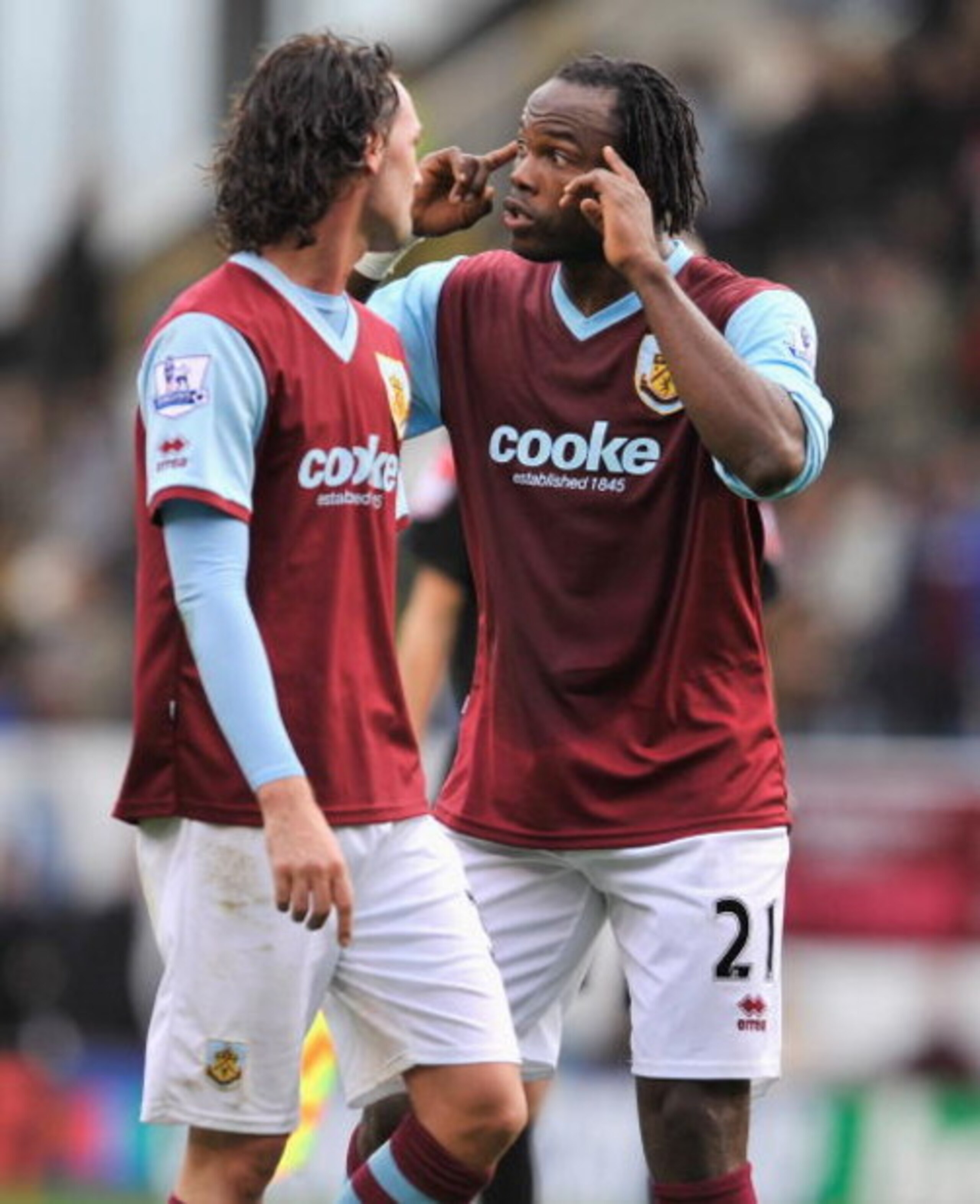 BURNLEY, ENGLAND - OCTOBER 24: Andre Bikey and Chris Eagles of Burnley have words at half time during the Barclays Premier League match between Burnley and Wigan Athletic at Turf Moor on October 24, 2009 in Burnley, England.  (Photo by Michael Regan/Getty
