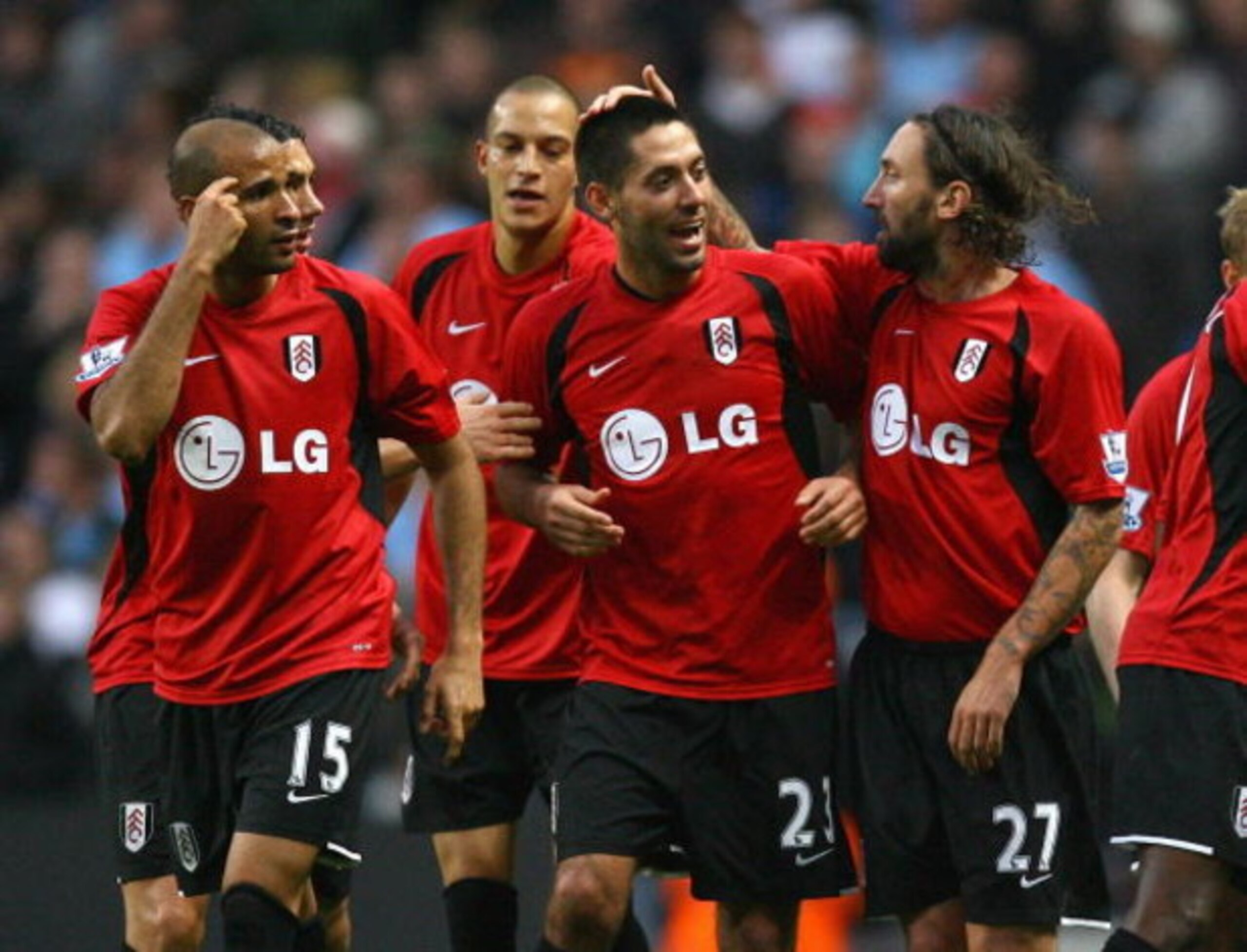 MANCHESTER, ENGLAND - OCTOBER 25:  Clint Dempsey (C) of Fulham celebrates with team mates after scoring the second equalizing goal during the Barclays Premier League match between Manchester City and Fulham at the City of Manchester Stadium on October 25,
