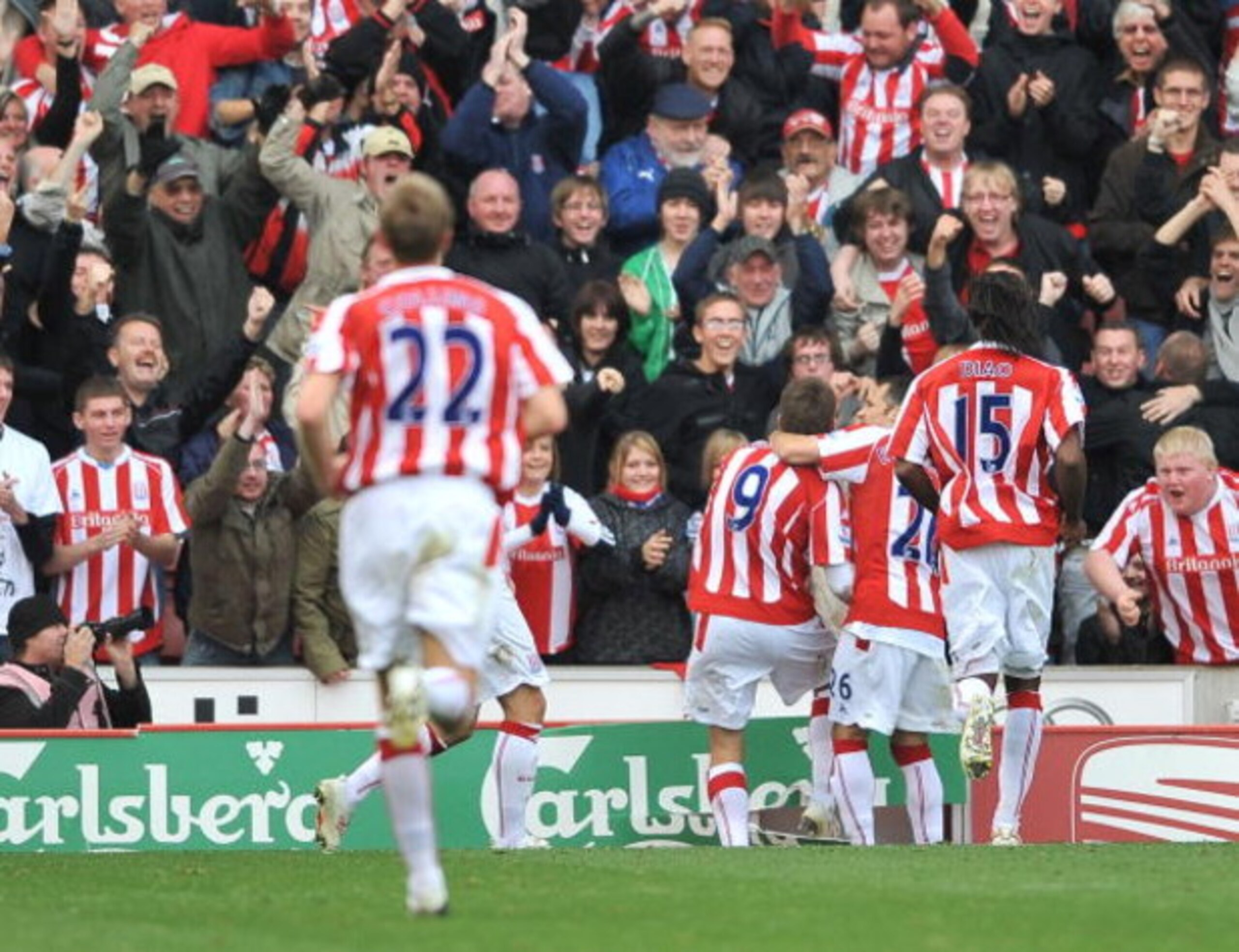 STOKE ON TRENT, ENGLAND - OCTOBER 17:  James Beattie of Stoke celebrates scoring their second goal as he kicks the advertising board during the Barclays Premier League match between Stoke City and West Ham United  at the Britannia Stadium on October 17, 2