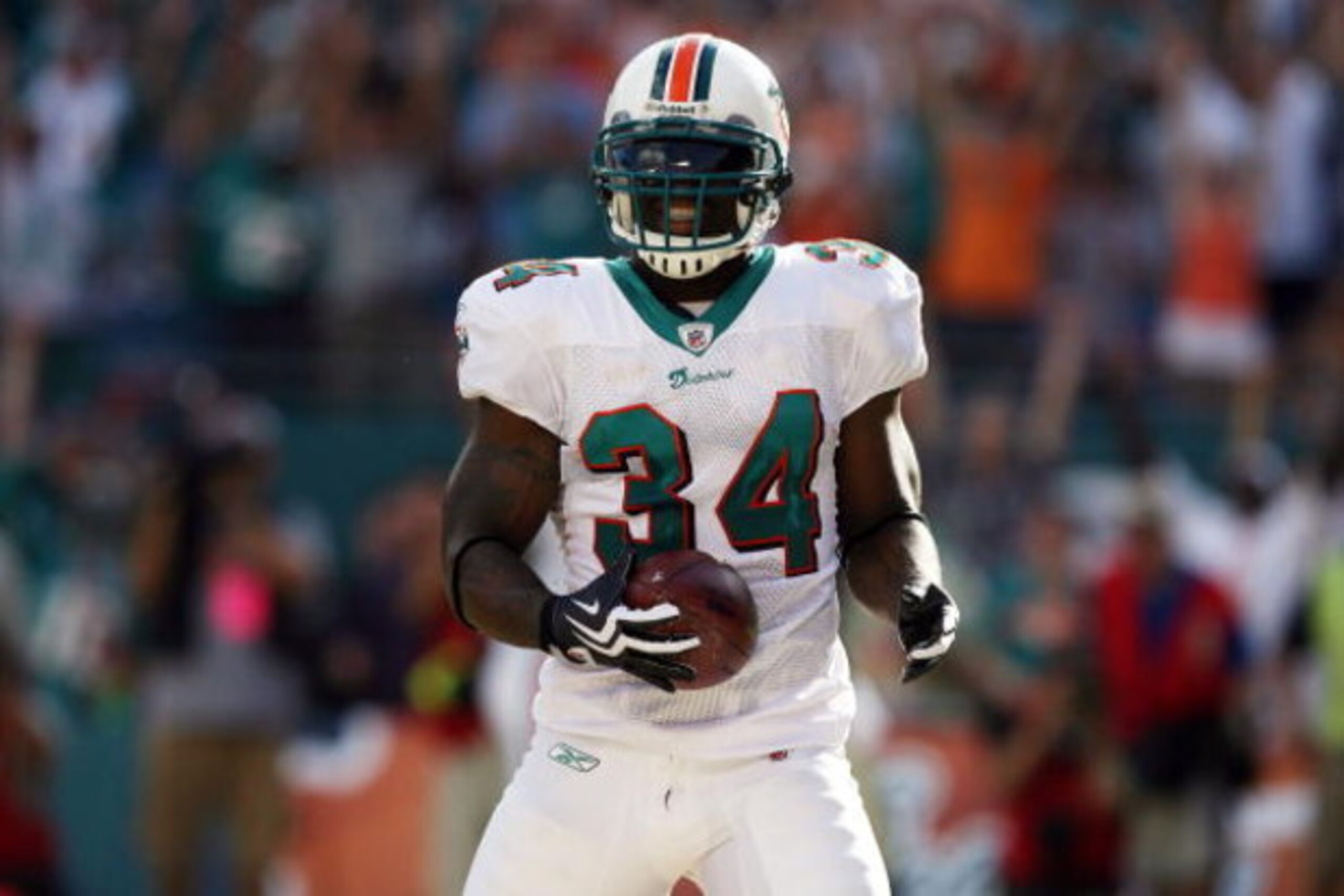 MIAMI - OCTOBER 25:  Running back Ricky Williams #34 of the Miami Dolphins celebrates a touchdown run against the New Orleans Saints at Land Shark Stadium on October 25, 2009 in Miami, Florida.  (Photo by Doug Benc/Getty Images)