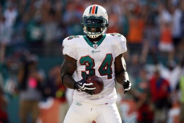 MIAMI - OCTOBER 25:  Running back Ricky Williams #34 of the Miami Dolphins celebrates a touchdown run against the New Orleans Saints at Land Shark Stadium on October 25, 2009 in Miami, Florida.  (Photo by Doug Benc/Getty Images)