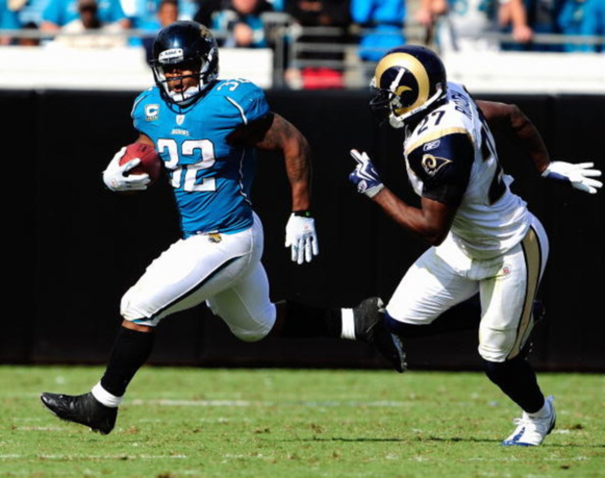 JACKSONVILLE, FL - OCTOBER 18:  Maurice Jones-Drew #32 of the Jacksonville Jaguars is chased by David Roach #27 of the St. Louis Rams during the game at Jacksonville Municipal Stadium on October 18, 2009 in Jacksonville, Florida.  (Photo by Sam Greenwood/
