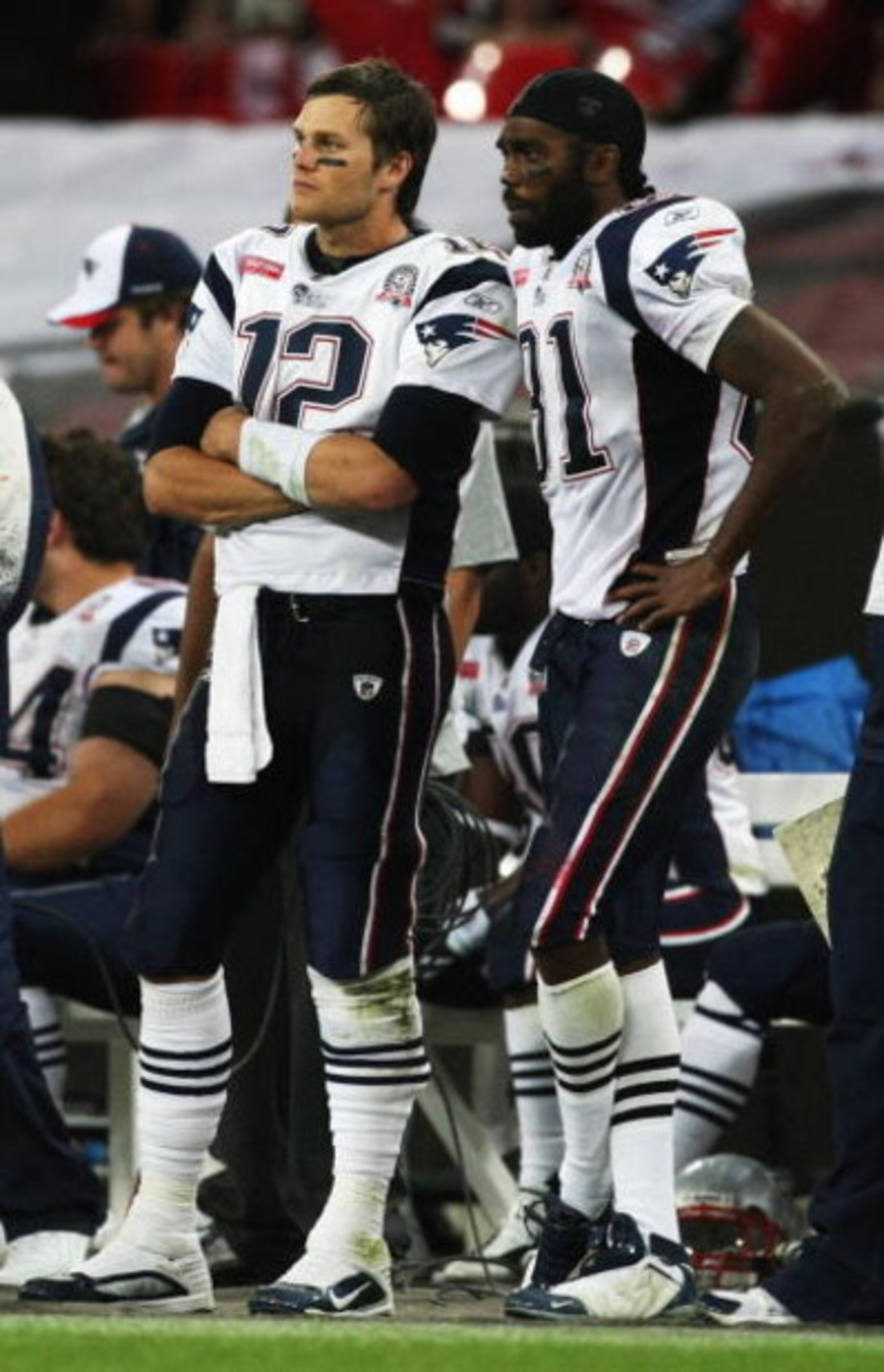 LONDON, ENGLAND - OCTOBER 25:  Tom Brady (#12) and Randy Moss (#81) of the New England Patriots look on during the NFL International Series match between New England Patriots and Tampa Bay Buccaneers at Wembley Stadium on October 25, 2009 in London, Engla