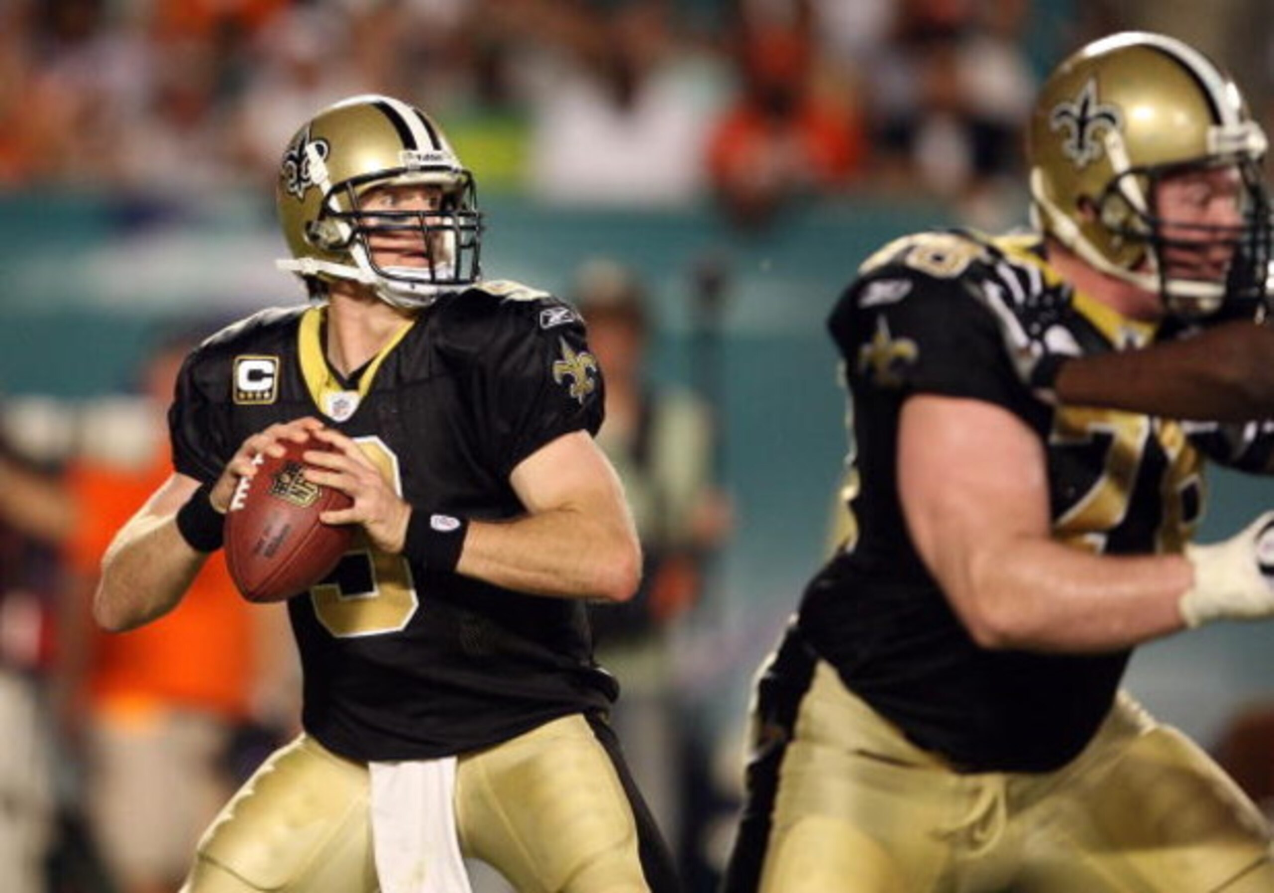 MIAMI - OCTOBER 25:  Quarterback Drew Brees #9 of the New Orleans Saints drops back to pass against the Miami Dolphins at Land Shark Stadium on October 25, 2009 in Miami, Florida. The Saints defeated the Dolphins 46-34.  (Photo by Doug Benc/Getty Images)