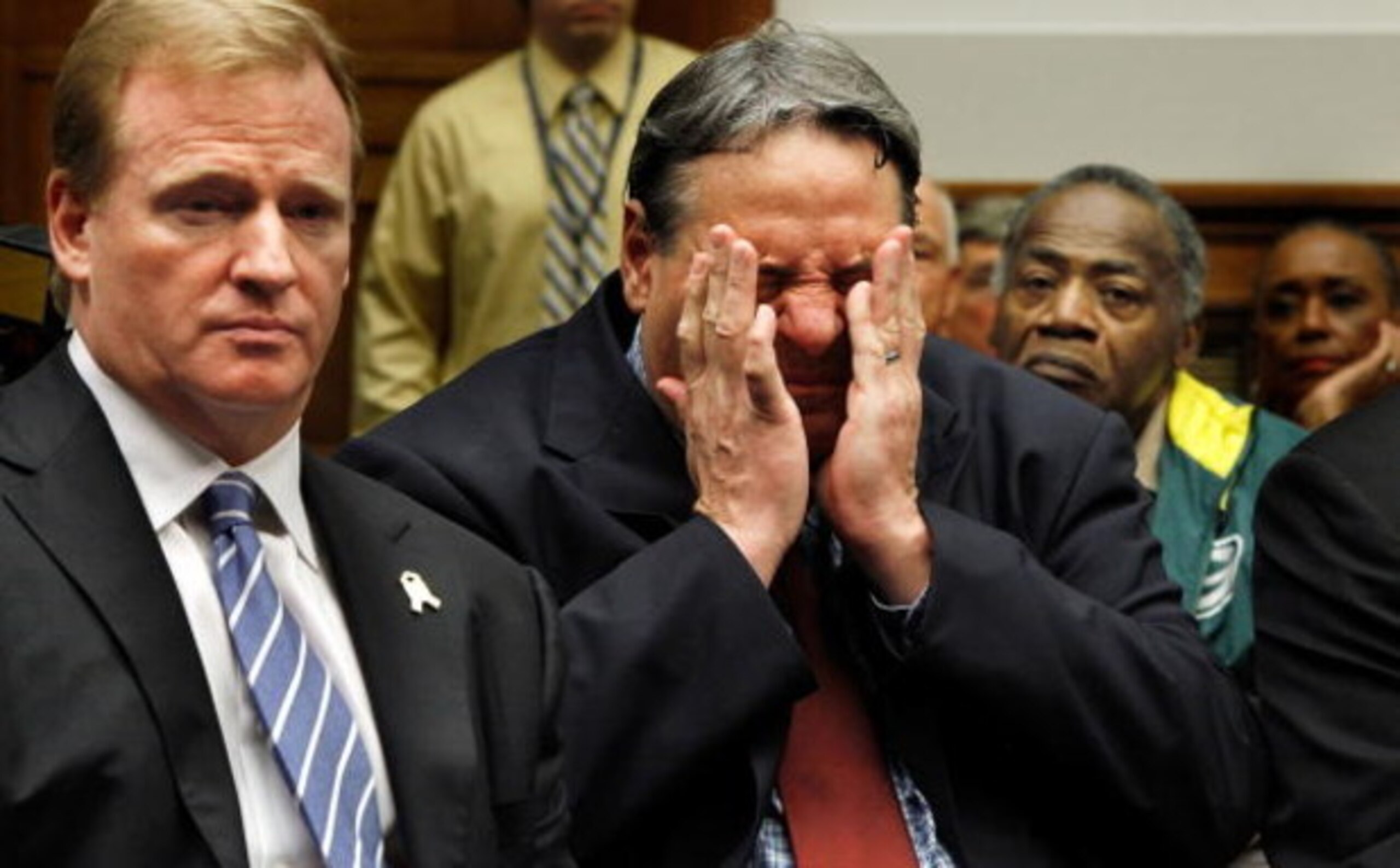WASHINGTON - OCTOBER 28:  Former National Football League player Brent Boyd (C) rubs his head while sitting next to NFL Commissioner Roger Goodell (L) during a hearing of the House Judiciary Committee about football brain injuries on Captiol Hill October 
