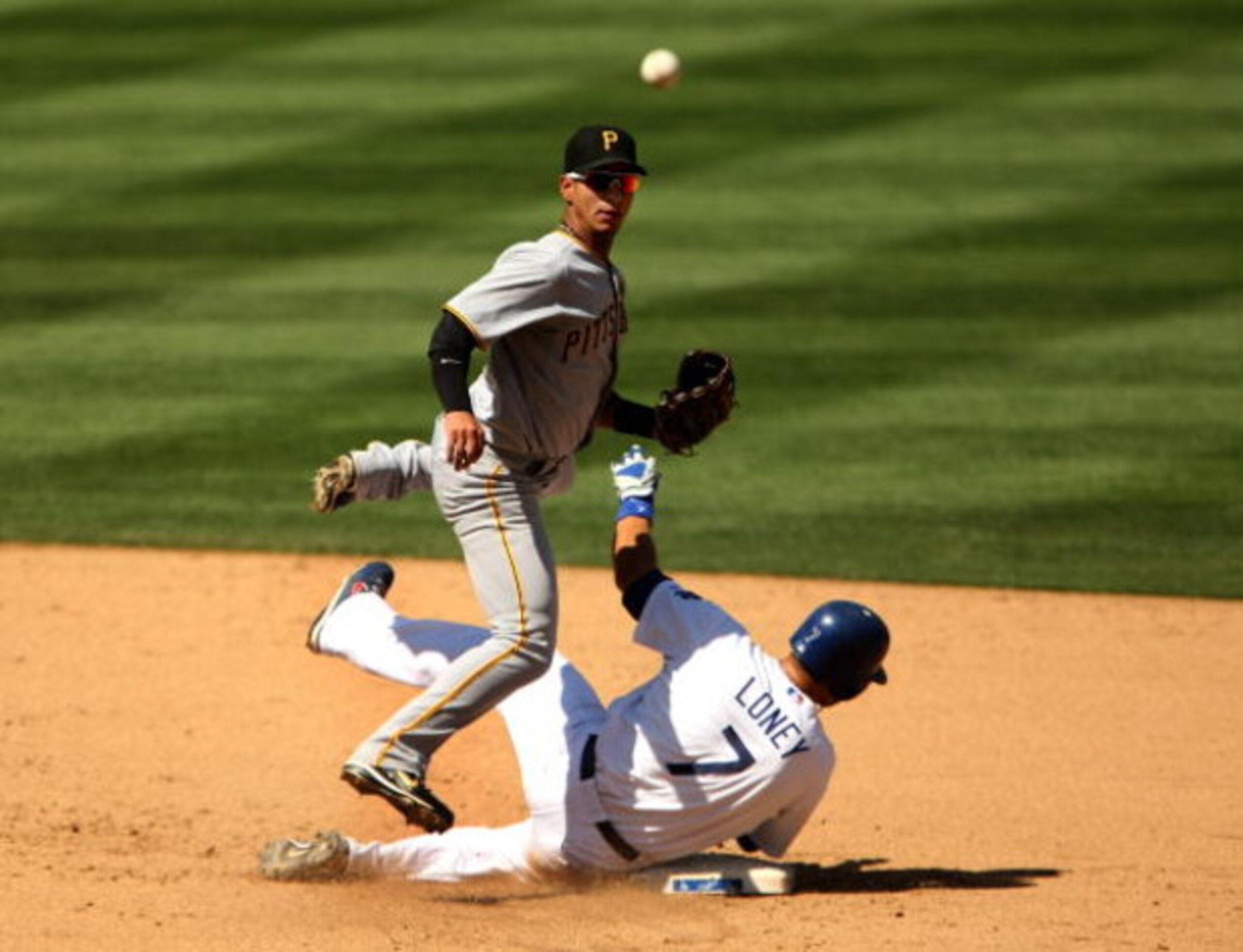 LOS ANGELES - SEPTEMBER 16:  Shortstop Ronny Cedeno #13 of the Pittsburgh Pirates throws to first to complete a double play after forcing out James Loney #7 of the Los Angeles Dodgers to end the sixth inning on September 16, 2009 at Dodger Stadium in Los 