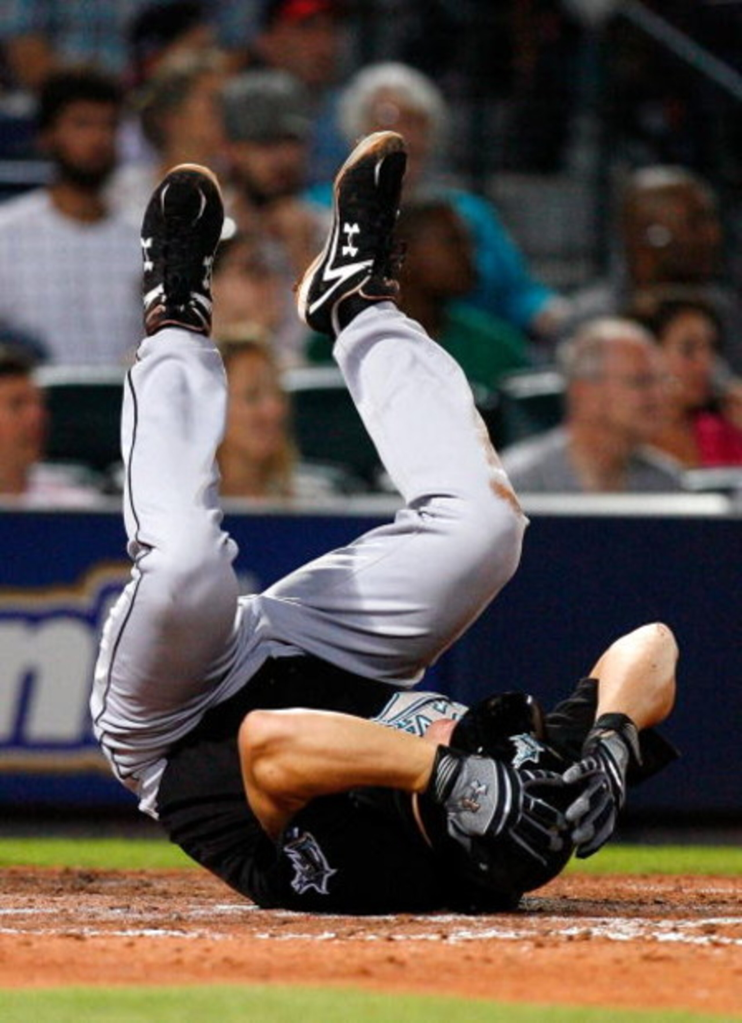 ATLANTA - AUGUST 22:  Wes Helms #18 of the Florida Marlins falls the ground after fouling a ball off his left foot against the Atlanta Braves on August 22, 2009 at Turner Field in Atlanta, Georgia.  (Photo by Kevin C. Cox/Getty Images)