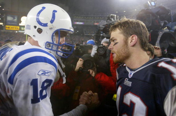 FOXBORO, MA - JANUARY 18:  Quarterback Tom Brady #12 of the New England Patriots and quarterback Peyton Manning #18 of the Indianapolis Colts greet each other on the field after the AFC Championship Game on January 18, 2004 at Gillette Stadium in Foxboro,
