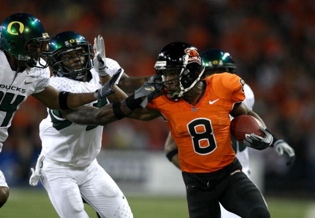 CORVALLIS, OR - NOVEMBER 29:  James Rodgers #8 of the Oregon State Beavers is tackled runs with the ball against Remene Alston Jr. #5 of the Oregon Ducks at Reser Stadium on November 29, 2008 in Corvalis, Oregon.  (Photo by Jonathan Ferrey/Getty Images)