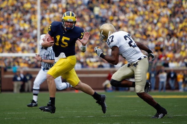 ANN ARBOR, MI - SEPTEMBER 15:  Ryan Mallett #15 of the Michigan Wolverines scrambles against David Bruton #27 of the Notre Dame Fighting Irish on September 15, 2007 at Michigan Stadium in Ann Arbor, Michigan. Michigan won 38-0. (Photo by Gregory Shamus/Ge