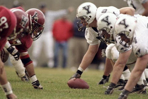 21 Nov 1998:  General view of the Harvard Crimson defensive line (left) lined up against the offensive line of the Yale Bulldogs during the game at the Harvard Stadium in Cambridge, Massachusetts. The Bulldogs defeated the Crimson 9-7. Mandatory Credit: A