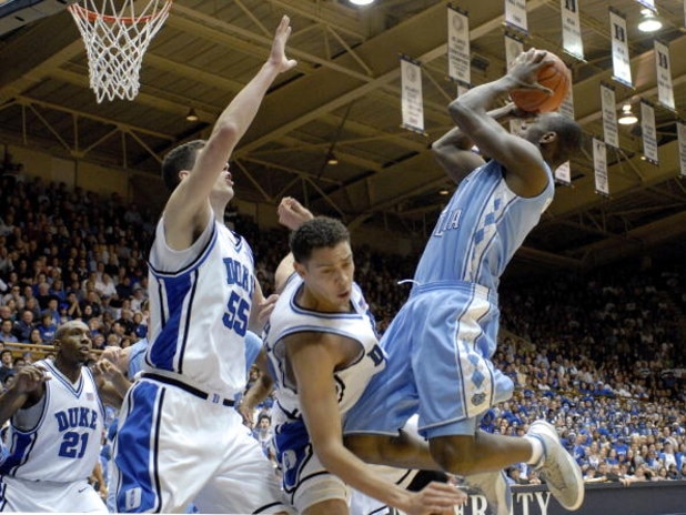 DURHAM, NC - FEBRUARY 07:  David McClure #14 of the Duke University Blue Devils fouls Marcus Ginyard #1 of the North Carolina Tar Heels during their game on February 7, 2007 at Cameron Indoor Stadium in Durham, North Carolina.  (Photo by Grant Halverson/G