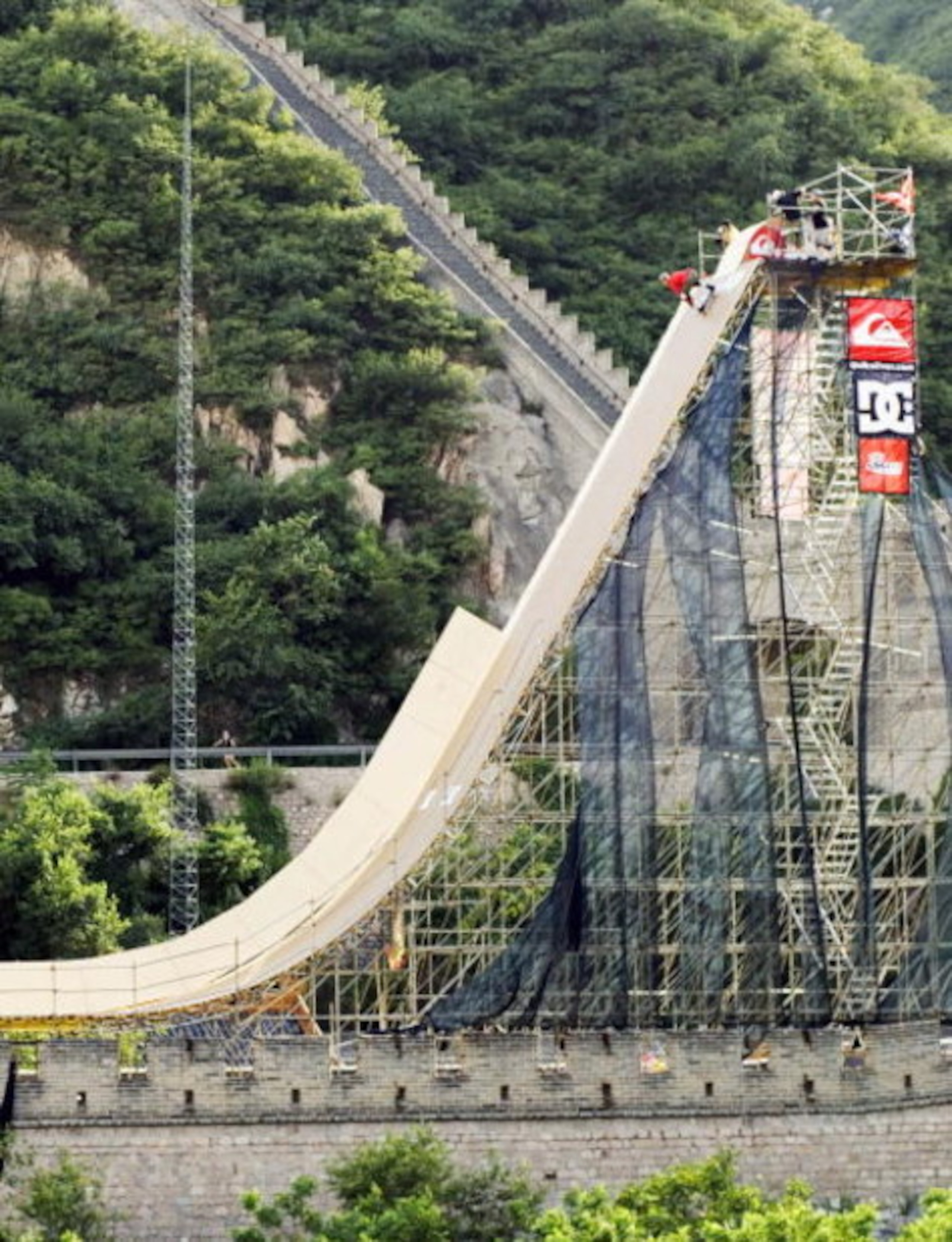 BEIJING, CHINA - JULY 9: Danny Way of the USA rolls in as he prepares to make the first Skateboard jump over the Great Wall Of China, July 9, 2005 in Beijing, China. Way attempted to break three world records by becoming the first person to successfully j