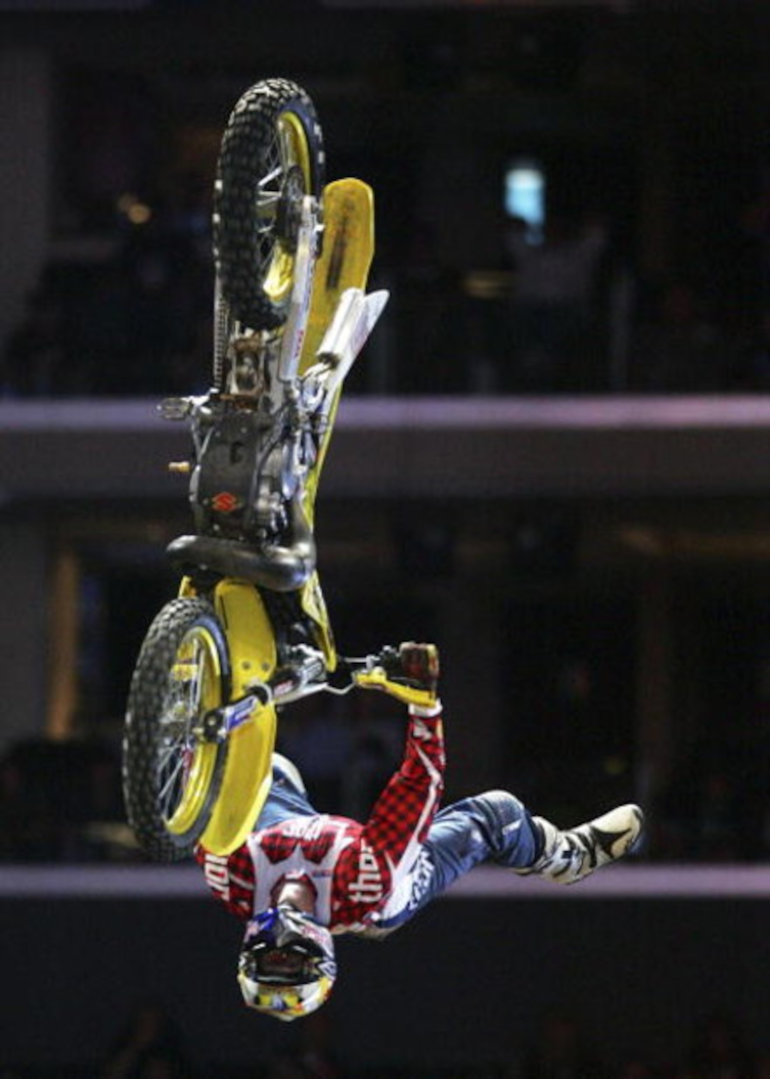 LOS ANGELES - AUGUST 4:  Travis Pastrana completes his first run in the Moto X Best Trick Final during the ESPN X Games on August 4, 2006 at the Staples Center in Los Angeles, California. Pastrana completed a double back flip on his second attempt and won