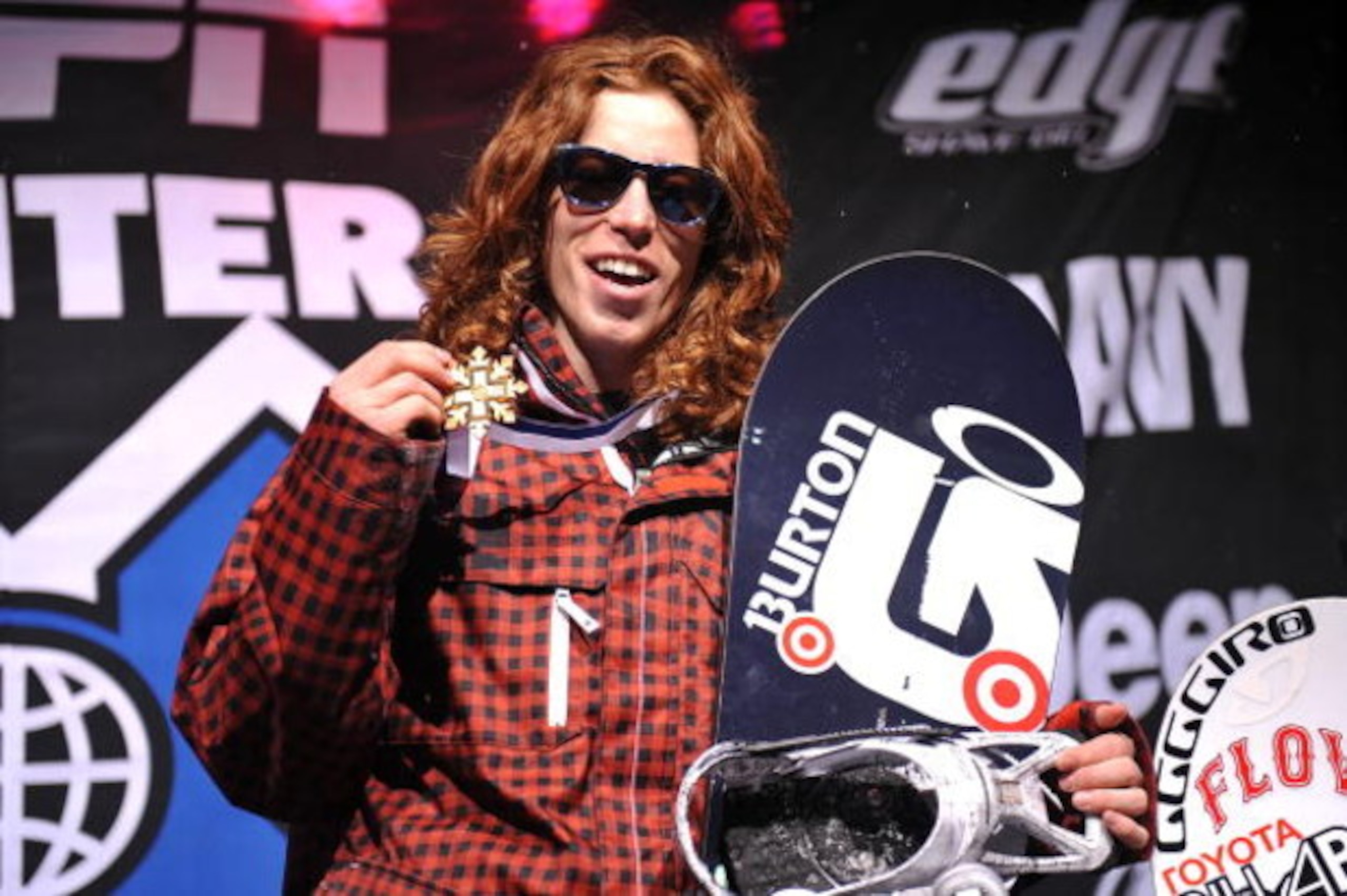 ASPEN, CO - JANUARY 25: Shaun White of Carlsbad, California celebrates as he takes the podium for the gold medal in the Men's Snowboard Superpipe Final at Winter X Games 13 on Buttermilk Mountain on January 25, 2009 in Aspen, Colorado. White became the fi