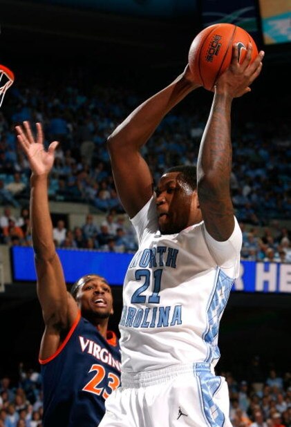 CHAPEL HILL, NC - FEBRUARY 07:  Deon Thompson #21 of the North Carolina Tar Heels grabs a rebound against Jeff Jones #23 of the Virginia Cavaliers during the game on February 7, 2009 at the Dean E. Smith Center in Chapel Hill, North Carolina.  (Photo by K