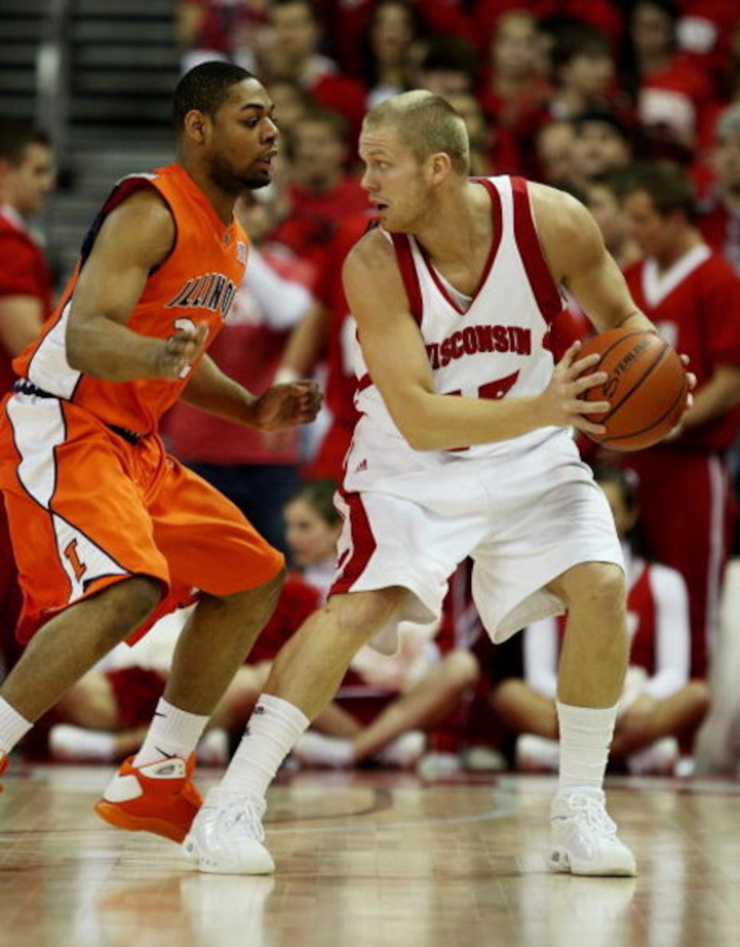 MADISON, WI - FEBRUARY 05: Joe Krabbenhoft #45 of the Wisconsin Badgers looks to pass under pressure from Demetri McCamey #32 of the Illinois Fighting Illini on February 5, 2009 at the Kohl Center in Madison, Wisconsin. Wisconsin defeated Illinois 63-50. 