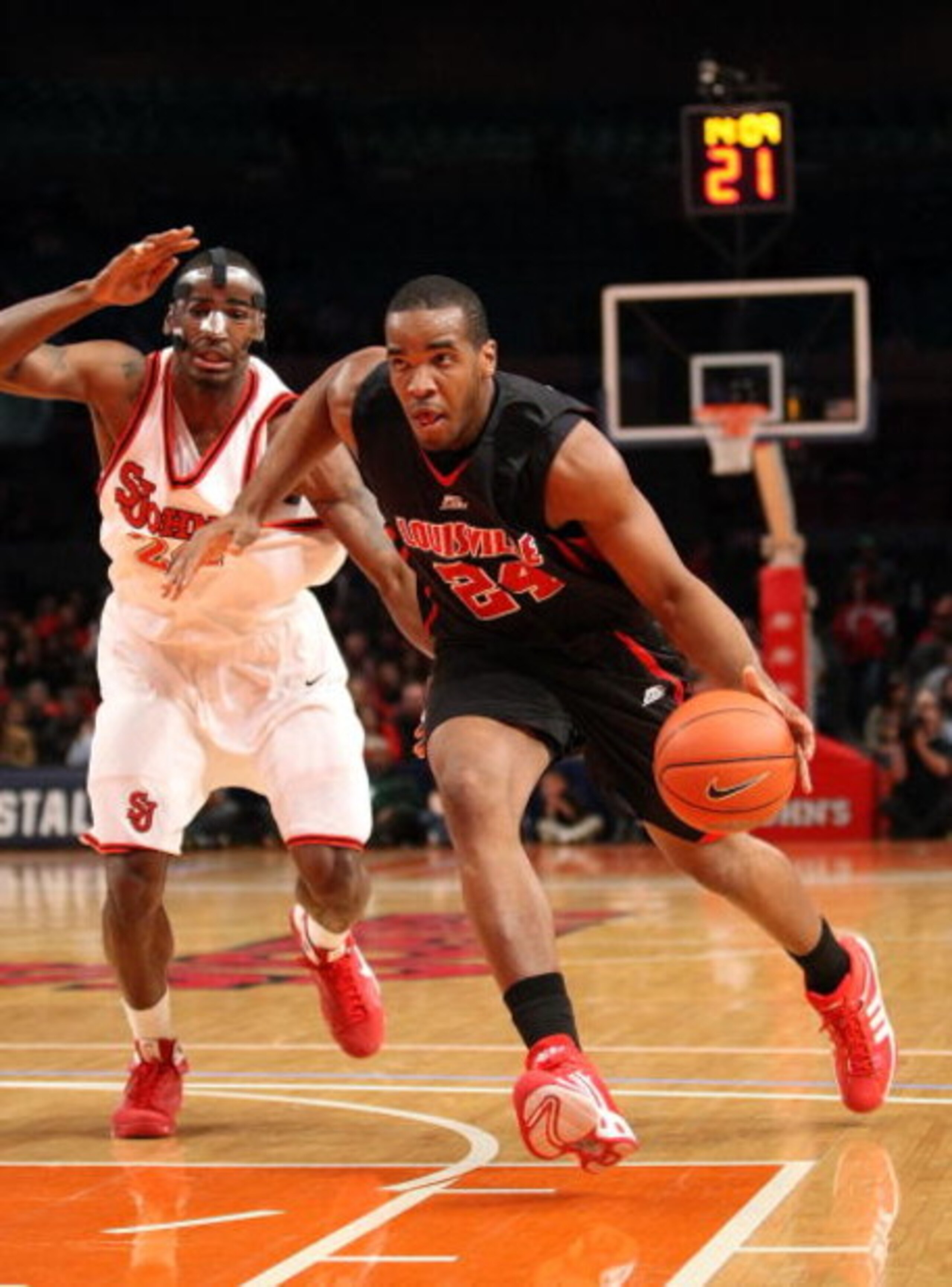NEW YORK - FEBRUARY 08:  Samardo Samuels #24 of the Louisville Cardinals drives to the basket against Justin Burrell #24 of St John's Red Storm on February 8, 2009 at Madison Square Garden in New York City, New York.  (Photo by Nick Laham/Getty Images)