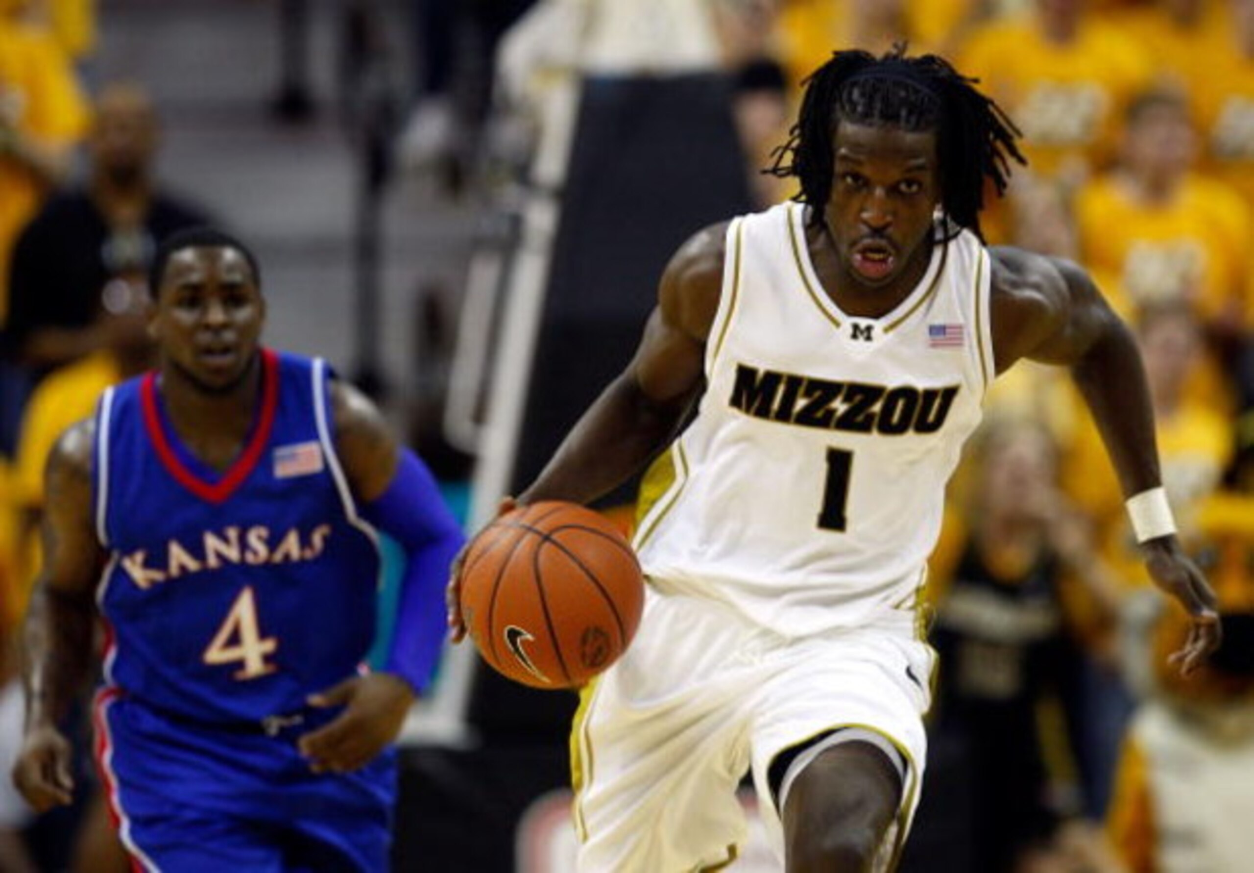 COLUMBIA, MO - FEBRUARY 09:  DeMarre Carroll #1 of the Missouri Tigers controls the ball on a fast break as Sherron Collins #4 of the Kansas Jayhawks chases during the game on February 9, 2009 at Mizzou Arena in Columbia, Missouri.  (Photo by Jamie Squire