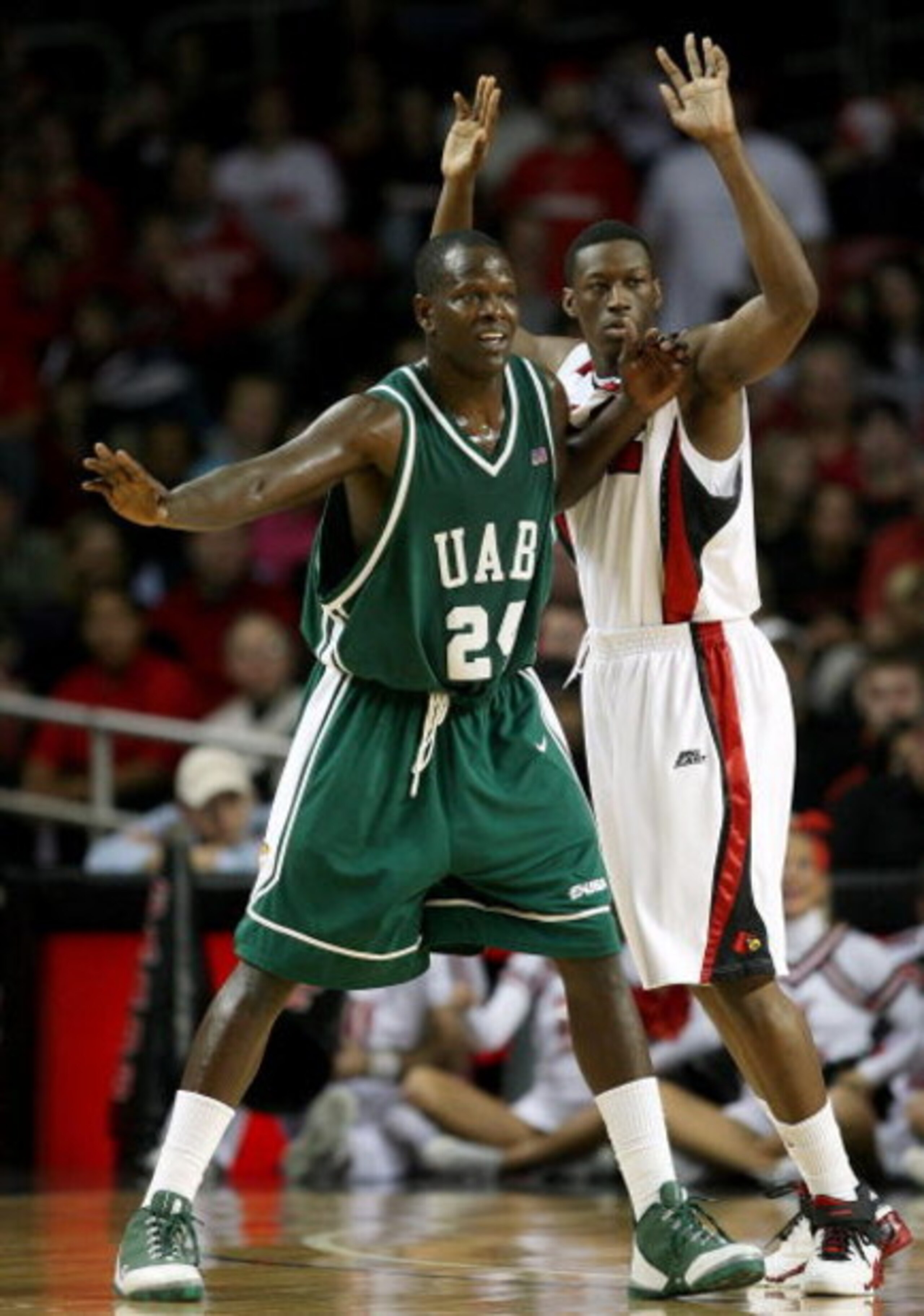 LOUISVILLE, KY - DECEMBER 27:  Robert Vaden #24 of the UAB Blazers is defended by Reginald Delk #12 of the Louisville Cardinals during the game on December 27, 2008 at Freedom Hall in Louisville, Kentucky.  (Photo by Andy Lyons/Getty Images)