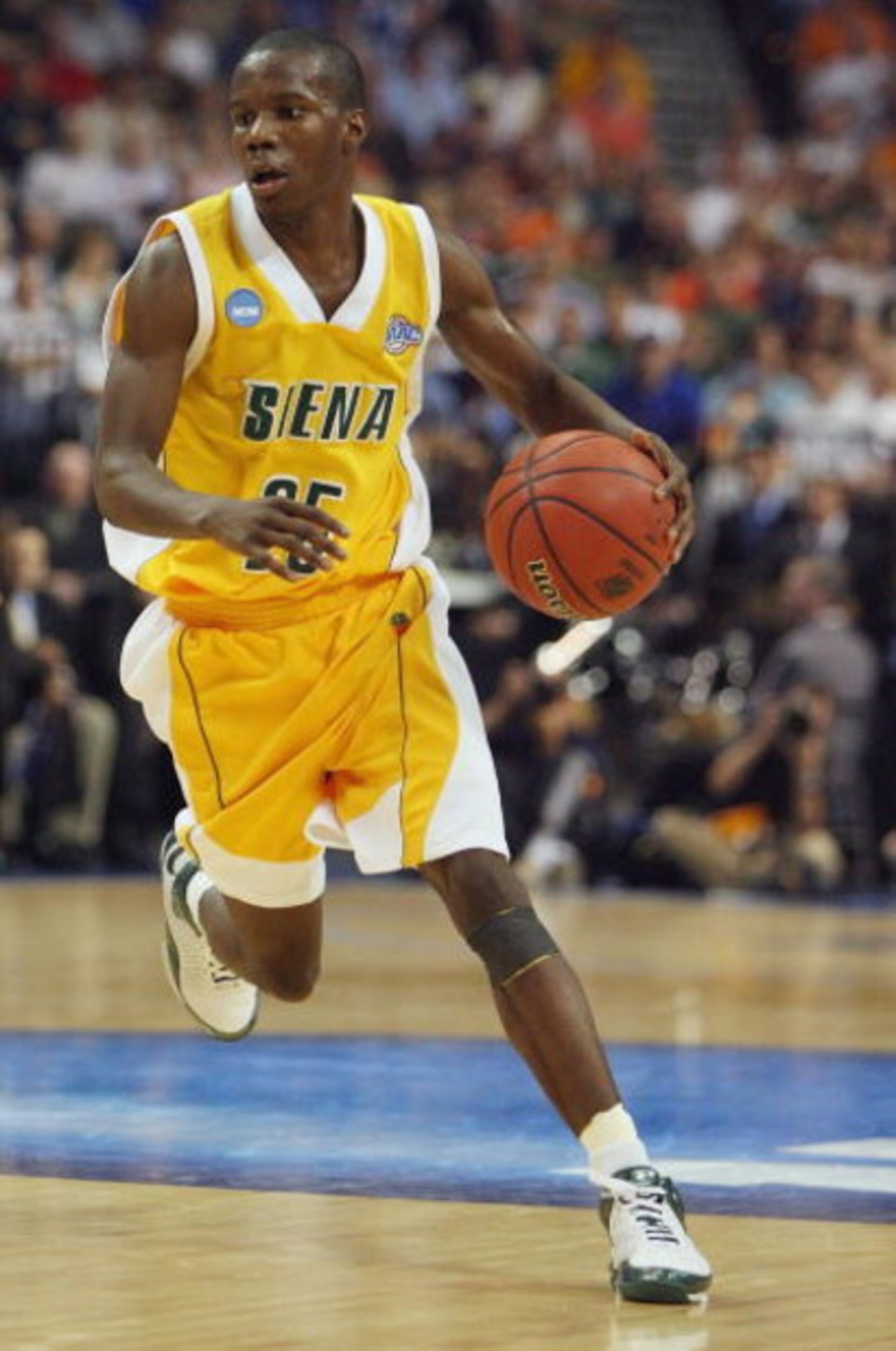 TAMPA, FL - MARCH 21: Ronald Moore #25 of the Siena Saints brings to ball up court during his team's 75-69 win over the Vanderbilt Commodores in the first round of the 2008 NCAA Tournament Midwest Regional at the St. Pete Times Forum on March 21, 2008 in 