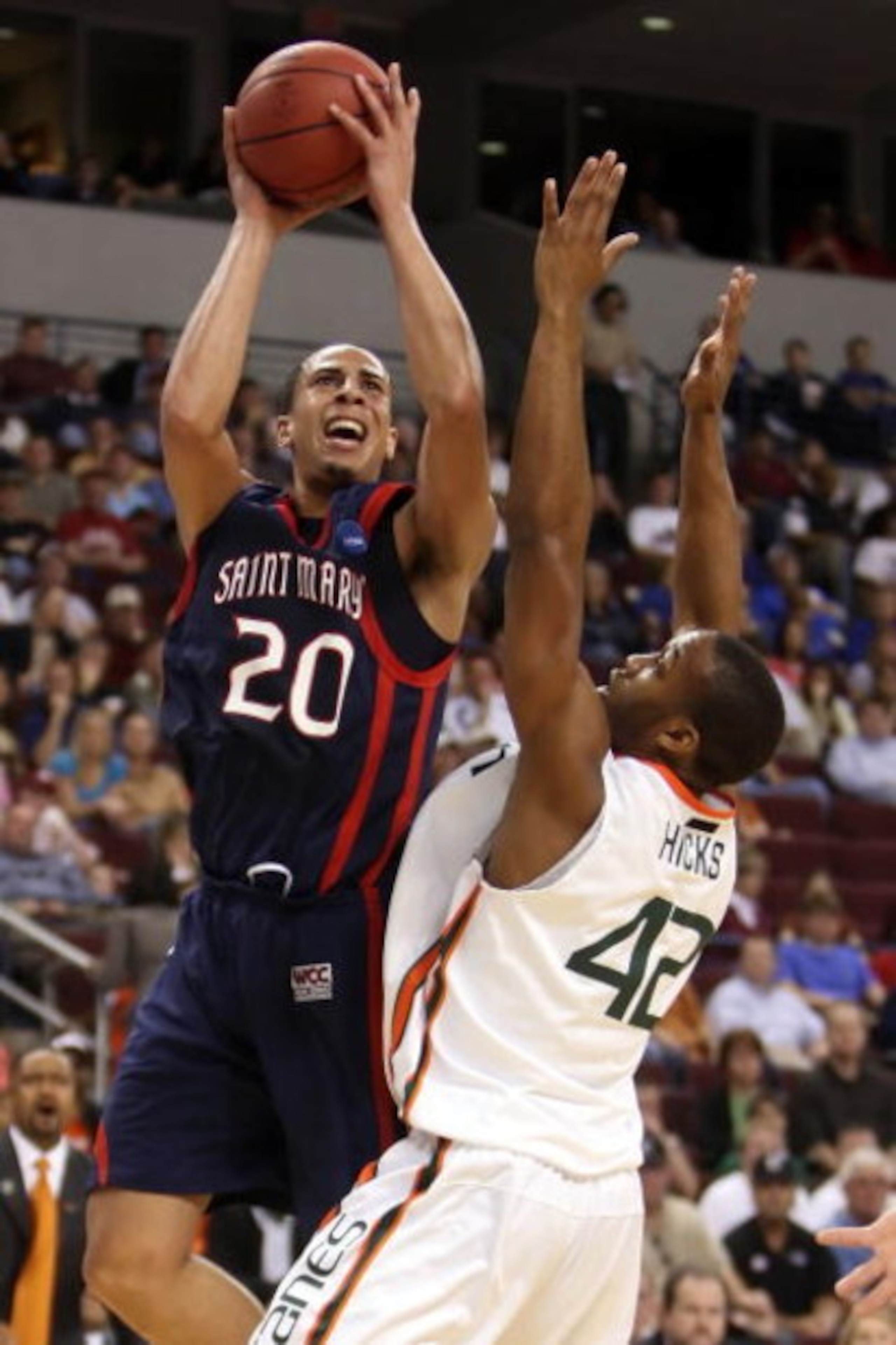 NORTH LITTLE ROCK, AR - MARCH 21:  Diamon Simpson #20 of the Saint Mary's Gaels shoots over Raymond Hicks #42 of the Miami Hurricanes during the first round of the South Regional as part of the 2008 NCAA Men's Basketball Tournament at Alltel Arena on Marc
