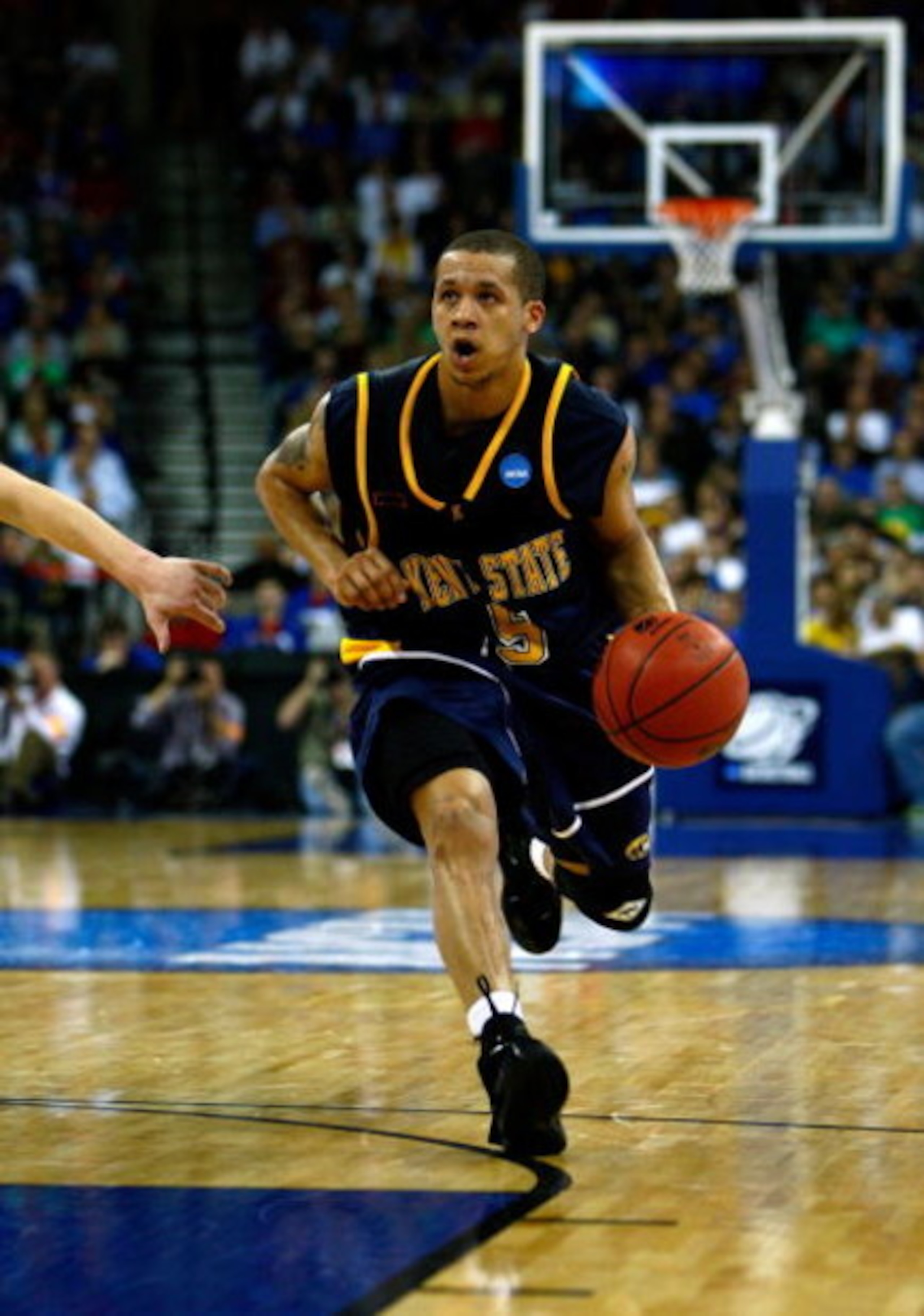 OMAHA, NE - MARCH 20:  Al Fisher #5 of the Kent State Golden Flashes brings the ball up court against the UNLV Runnin' Rebels against the Kent State Golden Flashes during the Midwest Region first round of the 2008 NCAA Men's Basketball Tournament on March