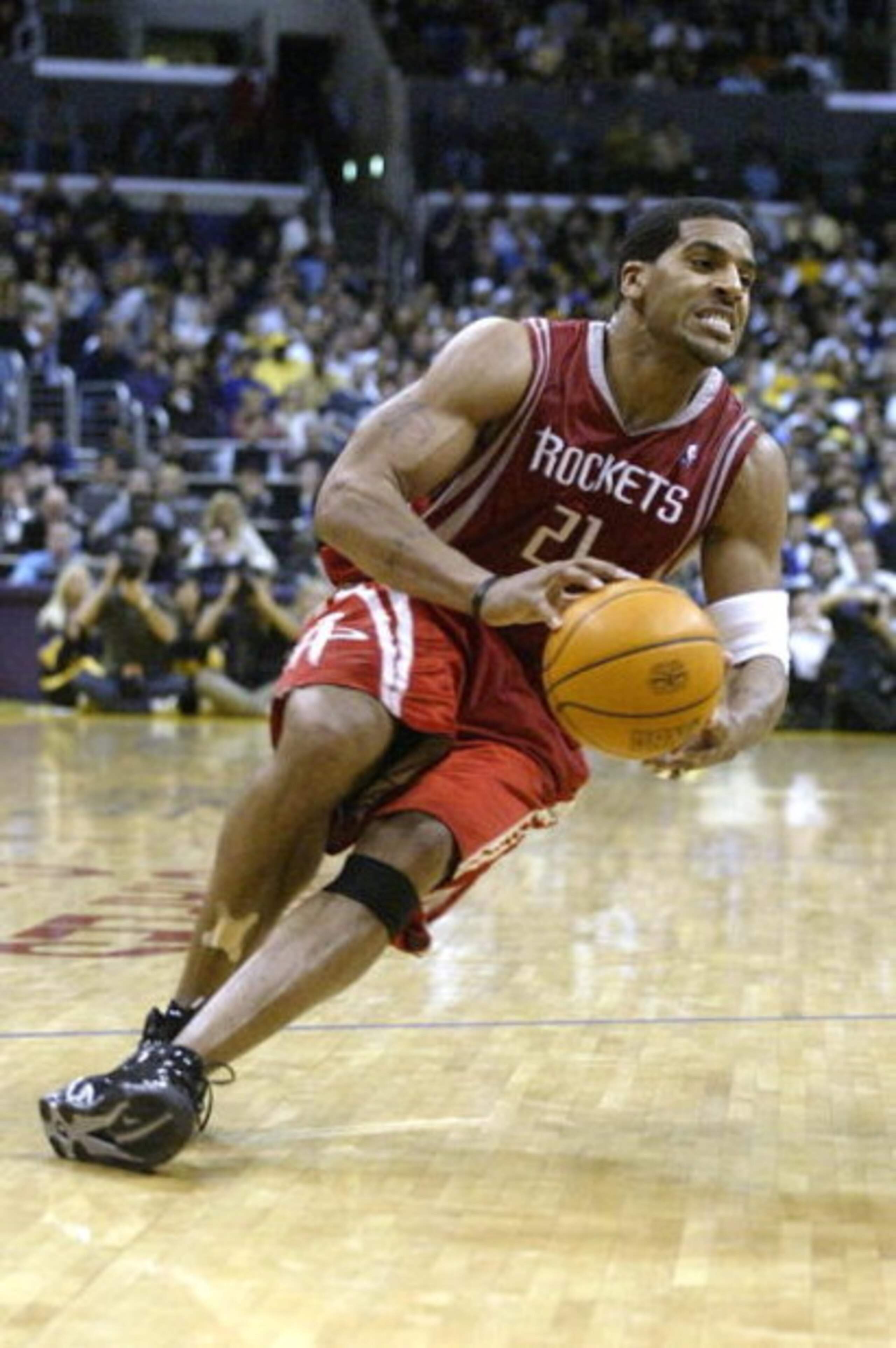 LOS ANGELES - APRIL 17:  Jim Jackson #21 of the Houston Rockets slips with the ball during Game one of the Western Conference Quarterfinals against the Los Angeles Lakers during the 2004 NBA Playoffs at Staples Center on April 17, 2004 in Los Angeles, Cal