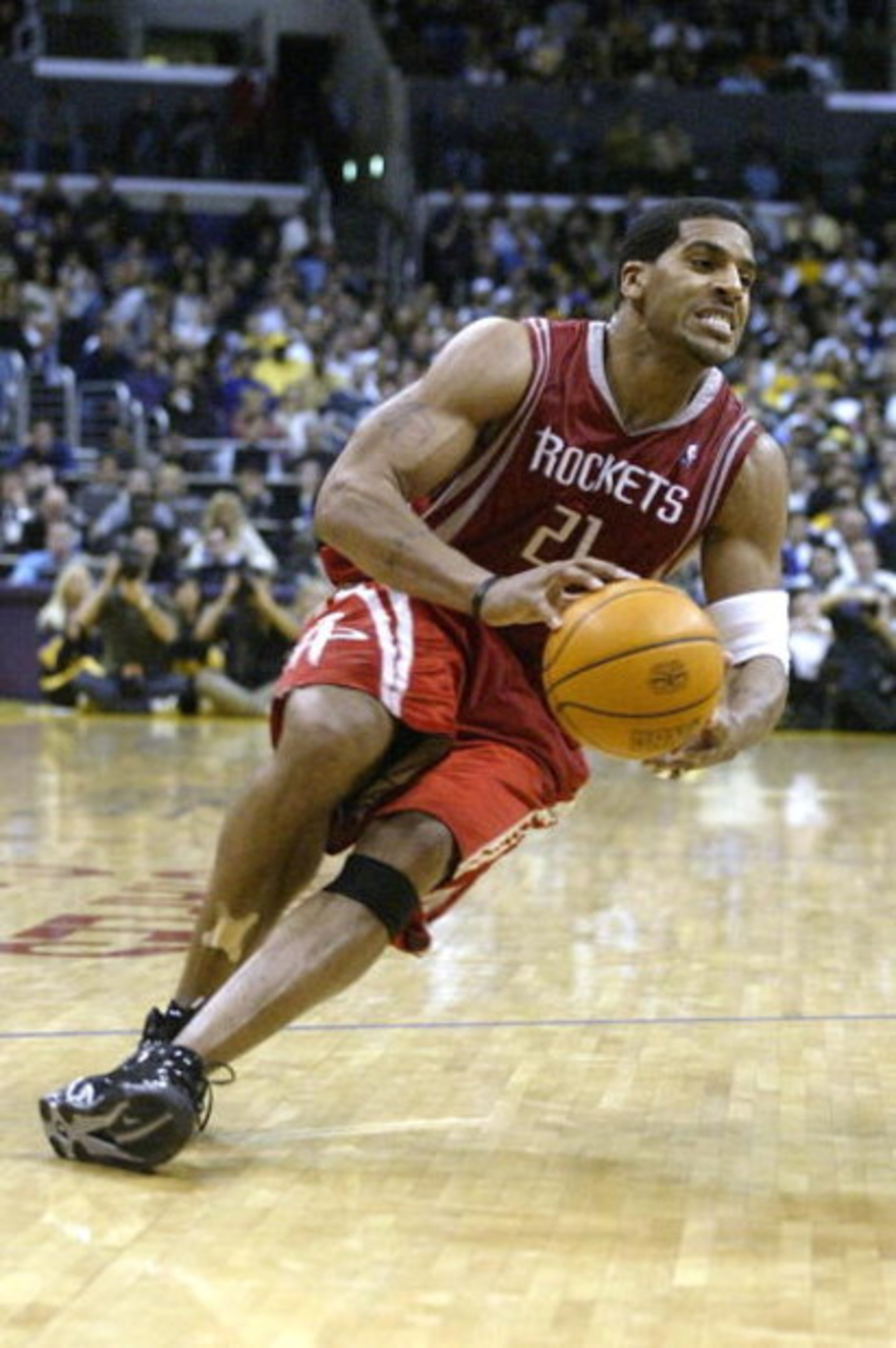 LOS ANGELES - APRIL 17:  Jim Jackson #21 of the Houston Rockets slips with the ball during Game one of the Western Conference Quarterfinals against the Los Angeles Lakers during the 2004 NBA Playoffs at Staples Center on April 17, 2004 in Los Angeles, Cal