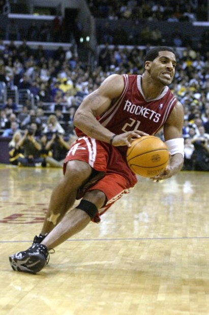 LOS ANGELES - APRIL 17:  Jim Jackson #21 of the Houston Rockets slips with the ball during Game one of the Western Conference Quarterfinals against the Los Angeles Lakers during the 2004 NBA Playoffs at Staples Center on April 17, 2004 in Los Angeles, Cal