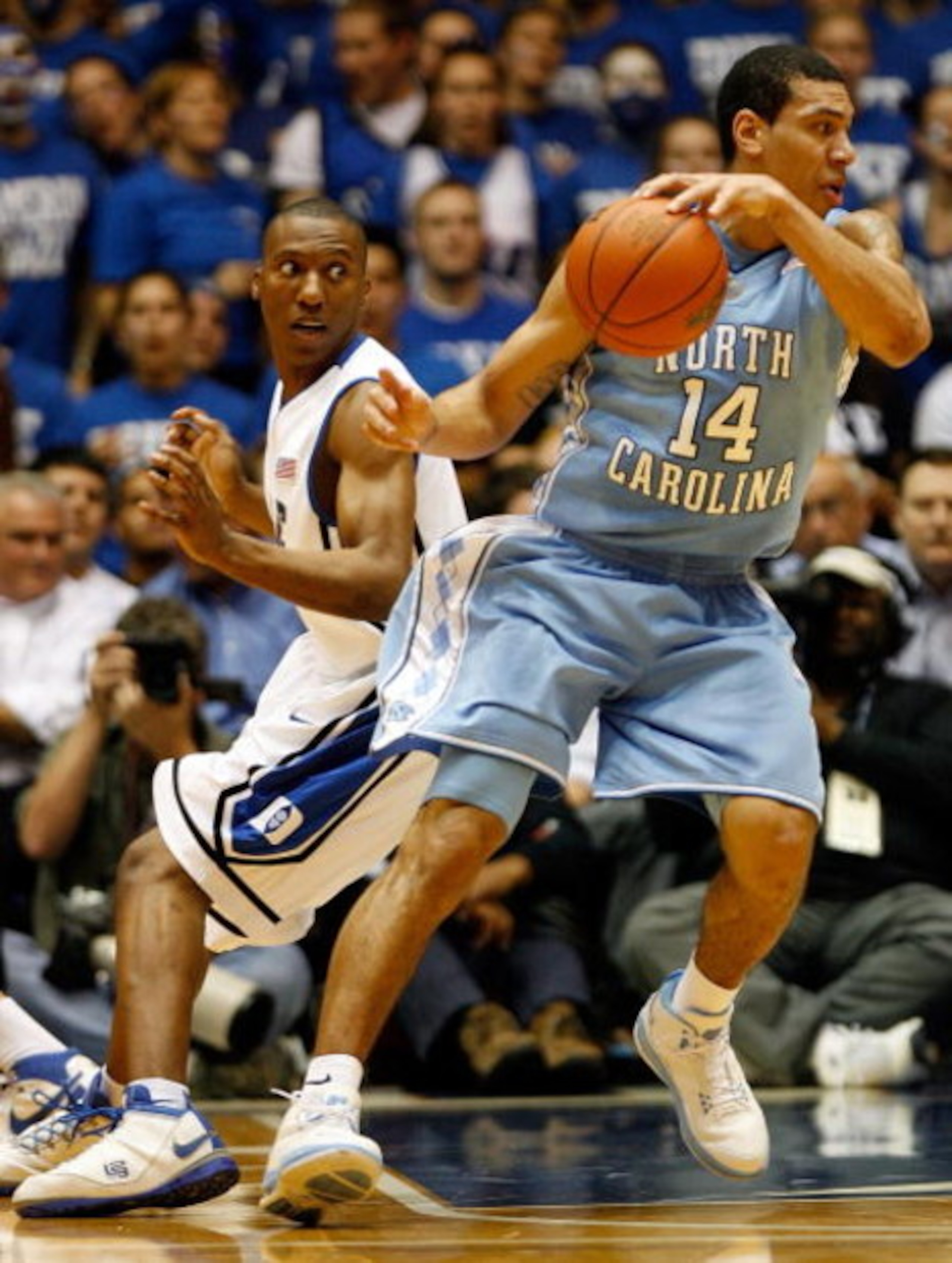 DURHAM, NC - FEBRUARY 11: Danny Green #14 of the North Carolina Tar Heels dribbles past Nolan Smith #2 of the Duke Blue Devils during the game on February 11, 2009 at Cameron Indoor Stadium in Durham, North Carolina. (Photo by Kevin Cox/Getty Images) DURHAM, NC - FEBRUARY 11: Danny Green #14 of the North Carolina Tar Heels dribbles past Nolan Smith #2 of the Duke Blue Devils during the game on February 11, 2009 at Cameron Indoor Stadium in Durham, North Carolina. (Photo by Kevin Cox/Getty Images)