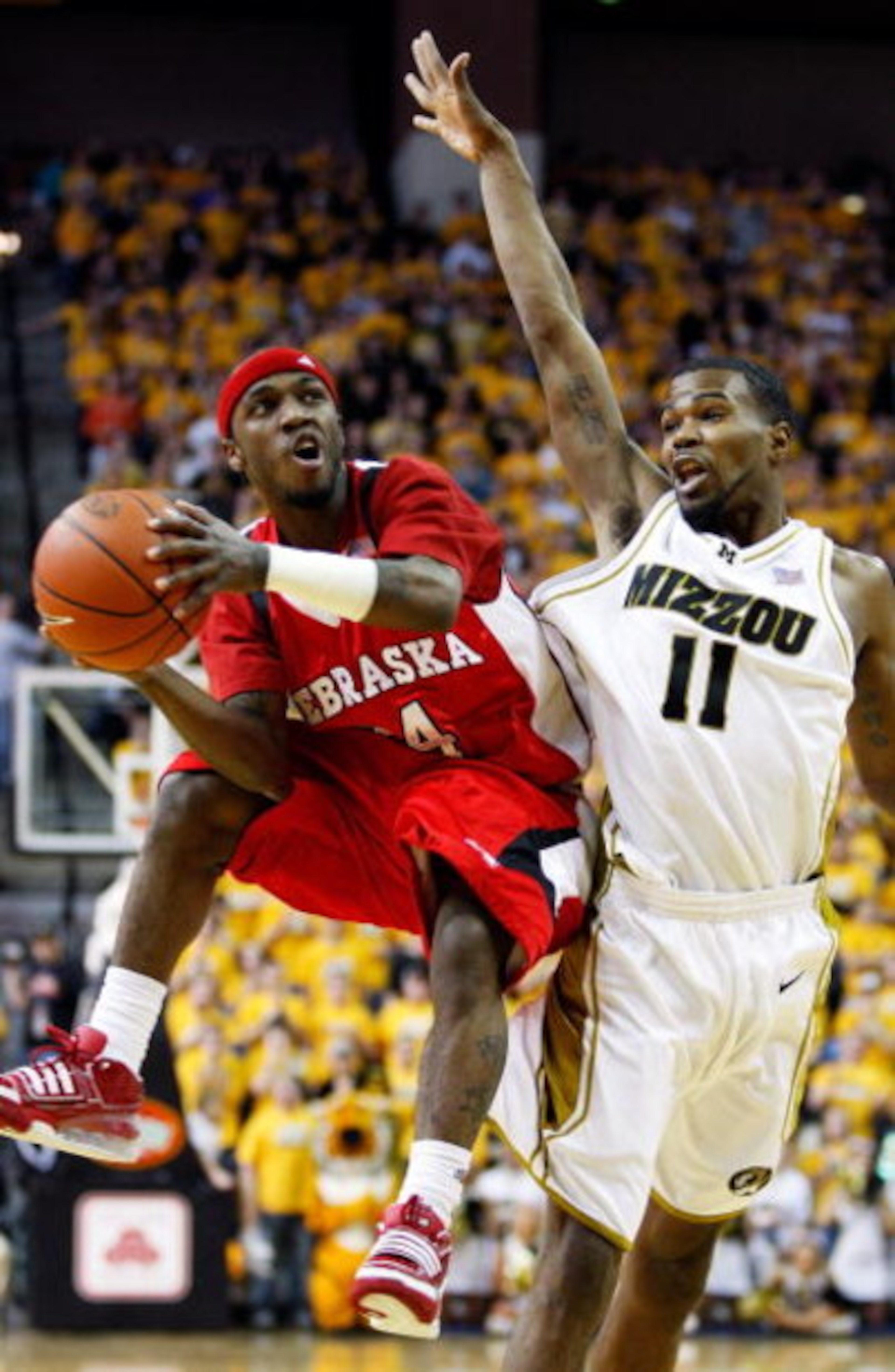 COLUMBIA, MO - FEBRUARY 14:  Cookie Miller #24 of the Nebraska Cornhuskers shoots as Zaire Taylor #11 of the Missouri Tigers defends during the game on February 14, 2009 at Mizzou Arena in Columbia, Missouri.  (Photo by Jamie Squire/Getty Images)
