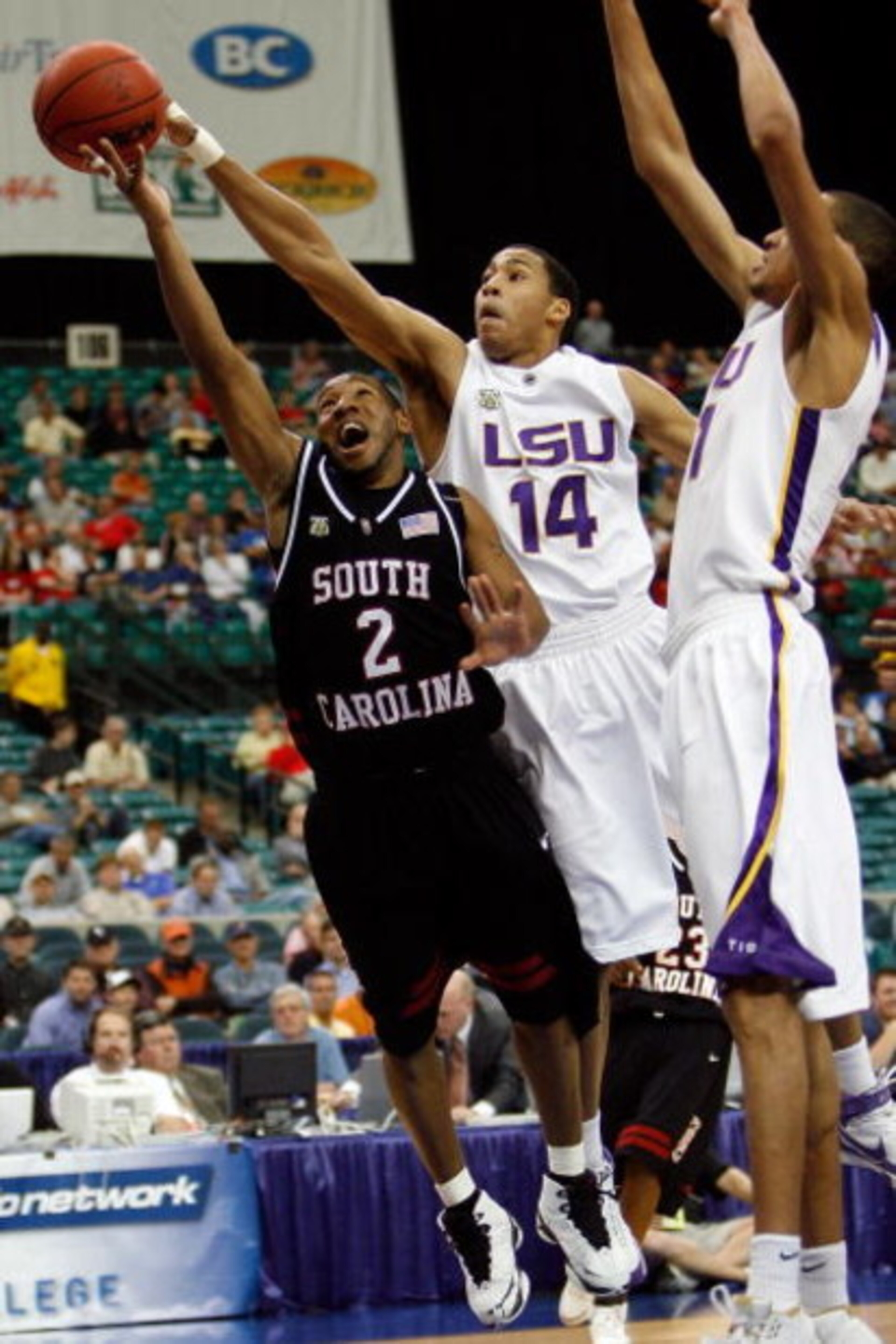 ATLANTA - MARCH 13:  Devan Downey #2 of the South Carolina Gamecocks has a shot blocked by Garrett Temple #14 of the Louisiana State University Tigers during the SEC Basketball Tournament on March 13, 2008 at the Georgia Dome in Atlanta, Georgia.  (Photo 