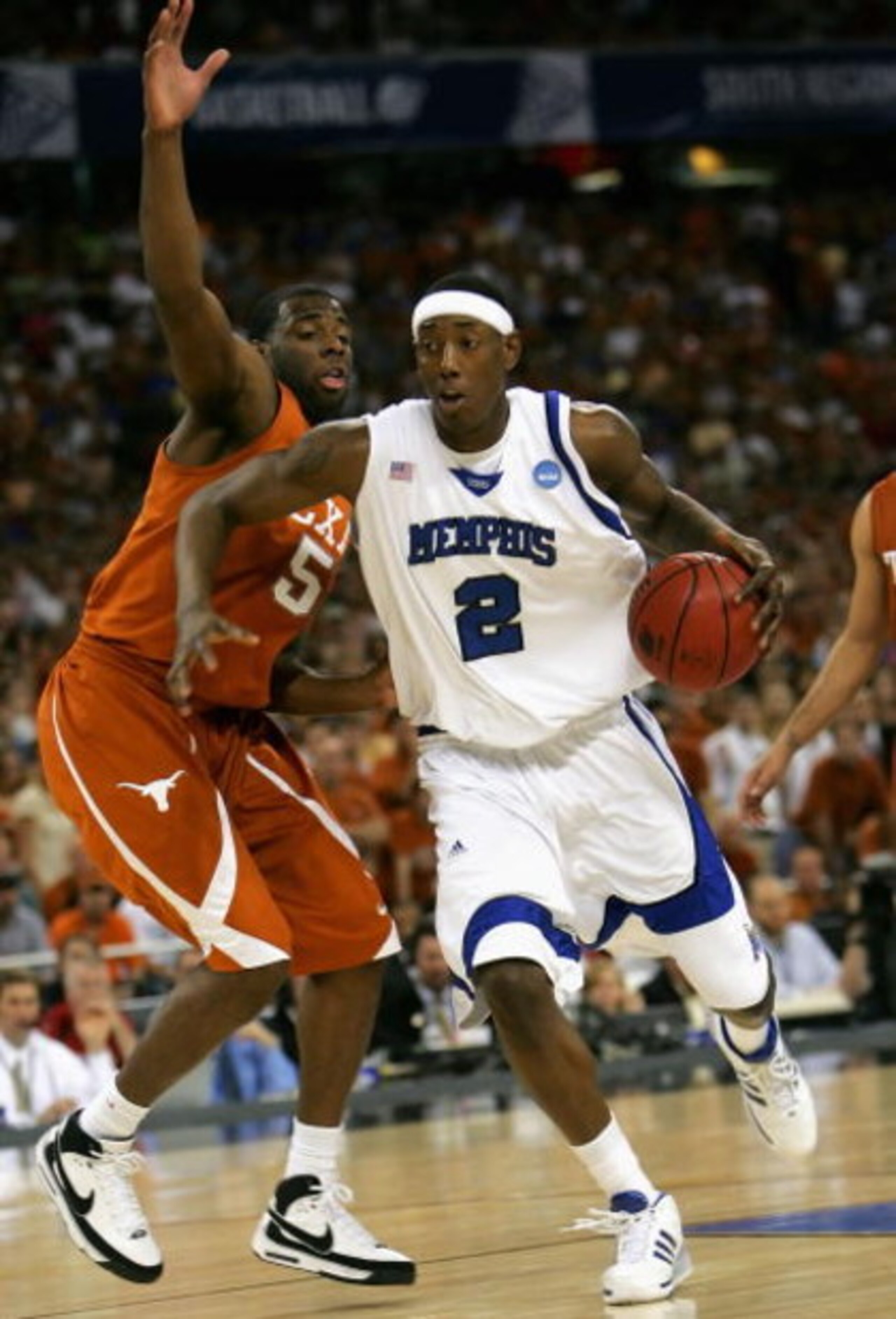 HOUSTON - MARCH 30: Robert Dozier #2 of the Memphis Tigers drives the ball past Damion James #5 of the Texas Longhorns during the fourth round game of the South Regional as part of 2008 NCAA Men's Basketball Tournament at Reliant Stadium on March 30, 200 HOUSTON - MARCH 30: Robert Dozier #2 of the Memphis Tigers drives the ball past Damion James #5 of the Texas Longhorns during the fourth round game of the South Regional as part of 2008 NCAA Men's Basketball Tournament at Reliant Stadium on March 30, 200