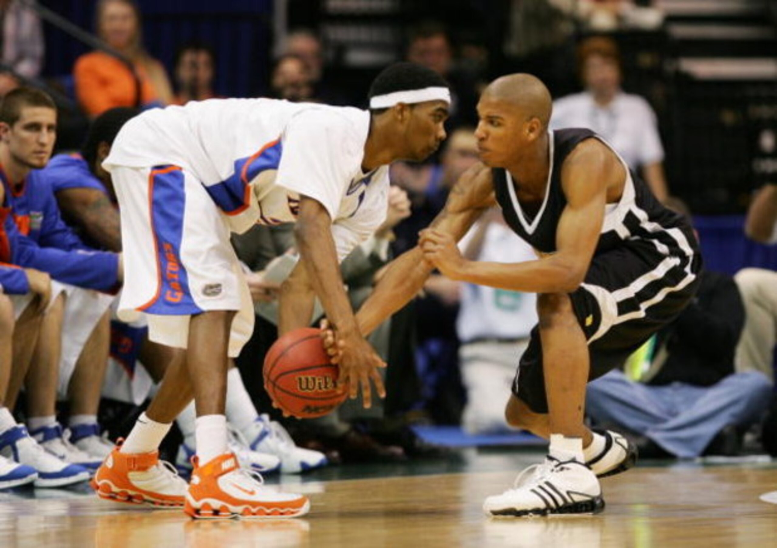 JACKSONVILLE, FL - MARCH 18: Avery Smith #3 of the Wisconsin-Milwaukee Panthers defends against Corey Brewer #2 of the Florida Gators during round two of the NCAA National Championship on March 18, 2006 at the Veterans Memorial Arena in Jacksonville, Flo JACKSONVILLE, FL - MARCH 18: Avery Smith #3 of the Wisconsin-Milwaukee Panthers defends against Corey Brewer #2 of the Florida Gators during round two of the NCAA National Championship on March 18, 2006 at the Veterans Memorial Arena in Jacksonville, Flo