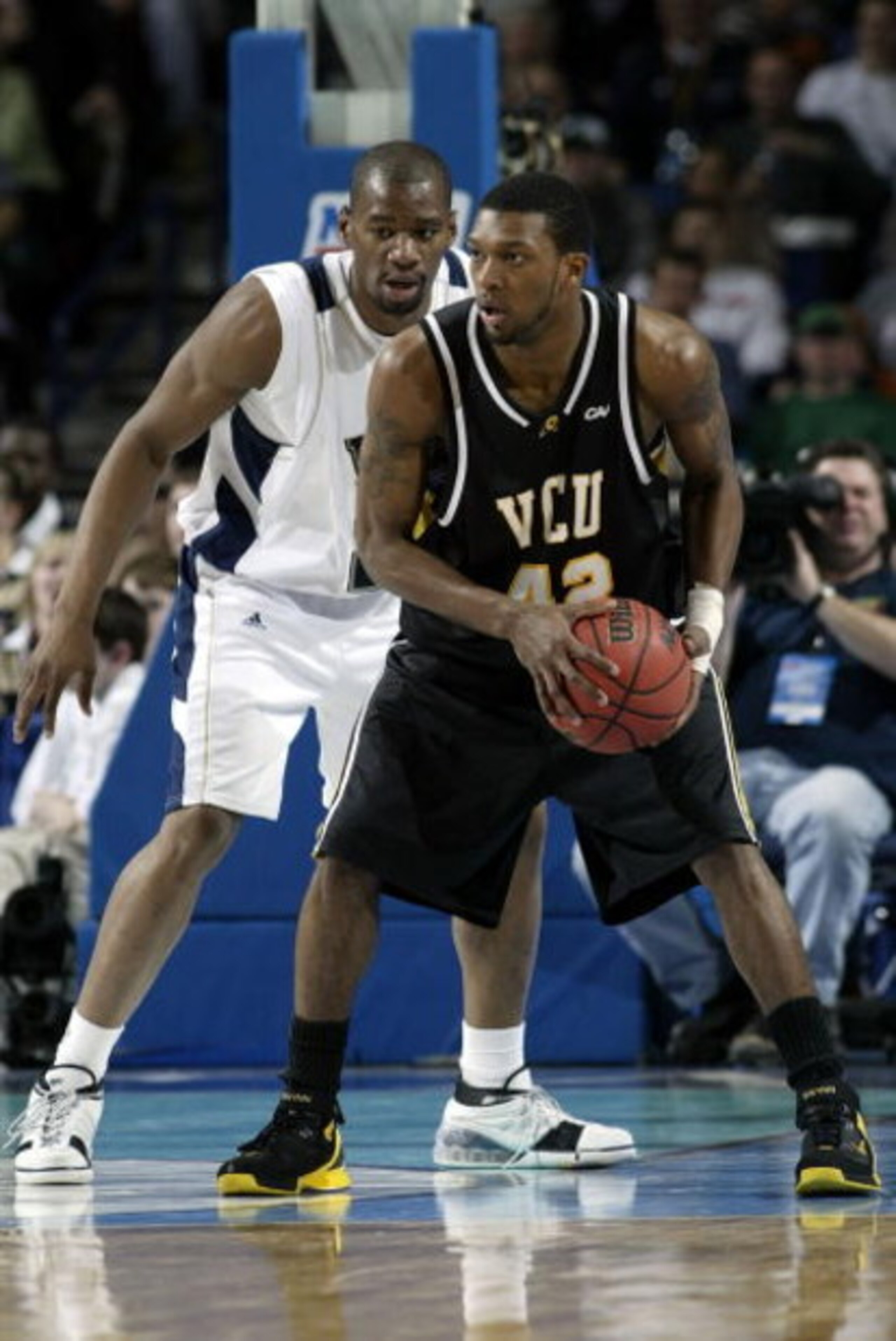 BUFFALO, NY - MARCH 17: Sam Young #23 of the Pittsburgh Panthers defends T.J. Gwynn #42 of the Virginia Commonwealth Rams during round two of the NCAA Men's Basketball Tournament at HSBC Arena on March 17, 2007 in Buffalo, New York. (Photo by Rick Stewa BUFFALO, NY - MARCH 17: Sam Young #23 of the Pittsburgh Panthers defends T.J. Gwynn #42 of the Virginia Commonwealth Rams during round two of the NCAA Men's Basketball Tournament at HSBC Arena on March 17, 2007 in Buffalo, New York. (Photo by Rick Stewa