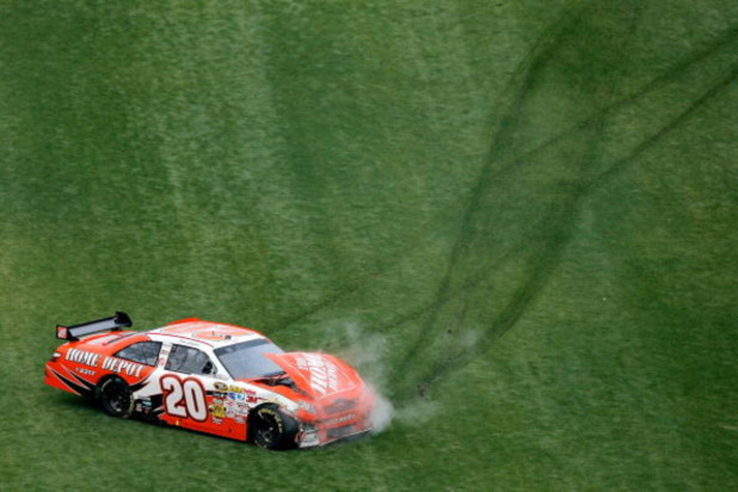 DAYTONA BEACH, FL - FEBRUARY 15: Joey Logano, driver of the #20 Home Depot Toyota, crashes during the NASCAR Sprint Cup Series Daytona 500 at Daytona International Speedway on February 15, 2009 in Daytona Beach, Florida.  (Photo by Matthew Stockman/Getty 