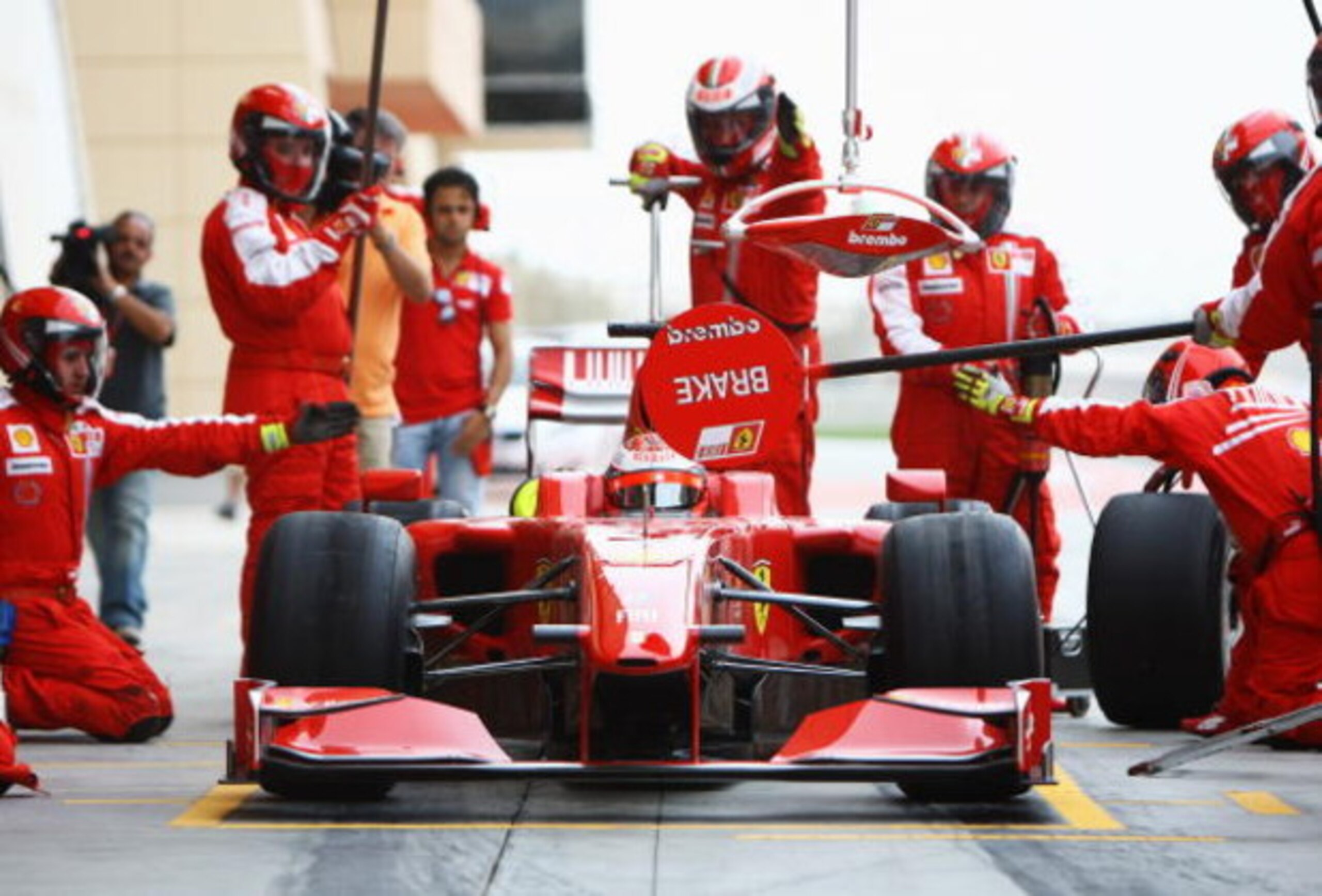 SAKHIR, BAHRAIN - FEBRUARY 17:  Kimi Raikkonen of Finland and Ferrari practices a pitstop during Formula One testing ahead of the 2009 Formula One season at the Bahrain International Circuit on February 17, 2009 in Sakhir, Bahrain.  (Photo by Paul Gilham/