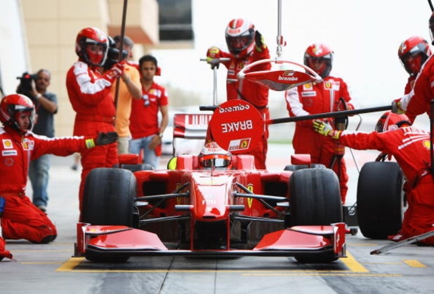 SAKHIR, BAHRAIN - FEBRUARY 17:  Kimi Raikkonen of Finland and Ferrari practices a pitstop during Formula One testing ahead of the 2009 Formula One season at the Bahrain International Circuit on February 17, 2009 in Sakhir, Bahrain.  (Photo by Paul Gilham/