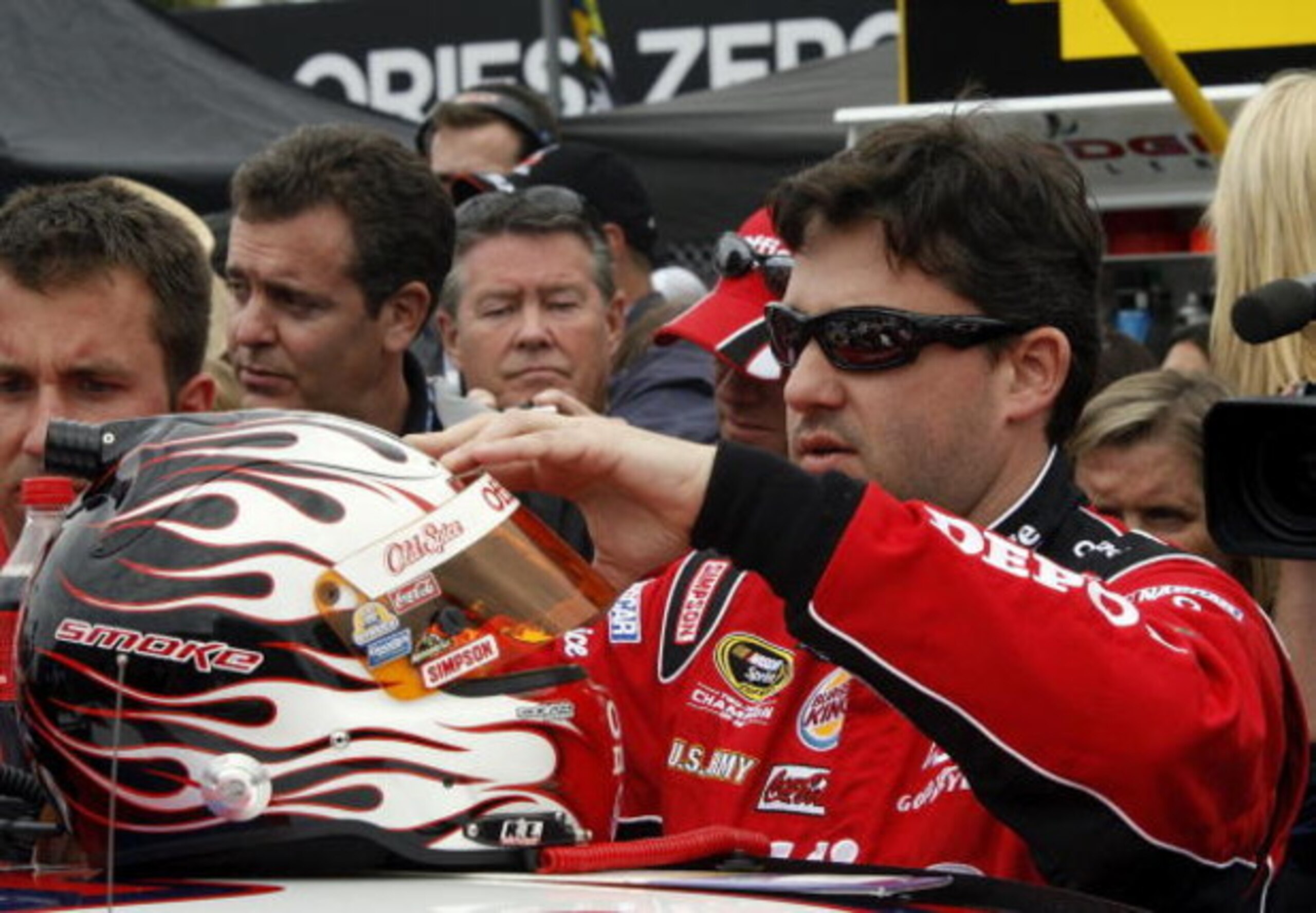 DAYTONA BEACH, FL - FEBRUARY 15:  Tony Stewart, driver of the #14 Office Depot/Old Spice Chevrolet, prepares to climb into his car prior to the NASCAR Sprint Cup Series Daytona 500 at Daytona International Speedway on February 15, 2009 in Daytona Beach, F